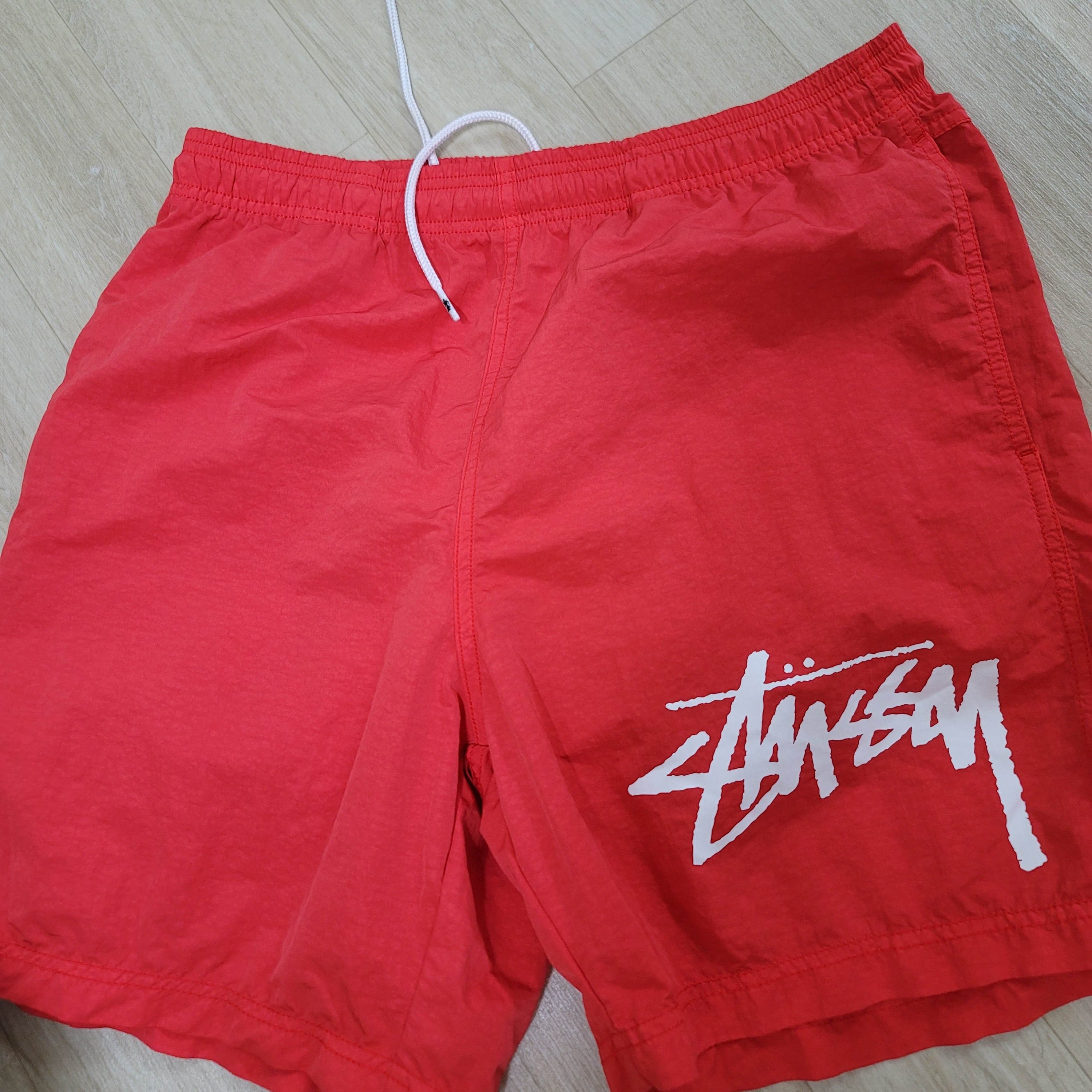 Nike x Stussy Water Shorts Habanero Red 착용 스타일