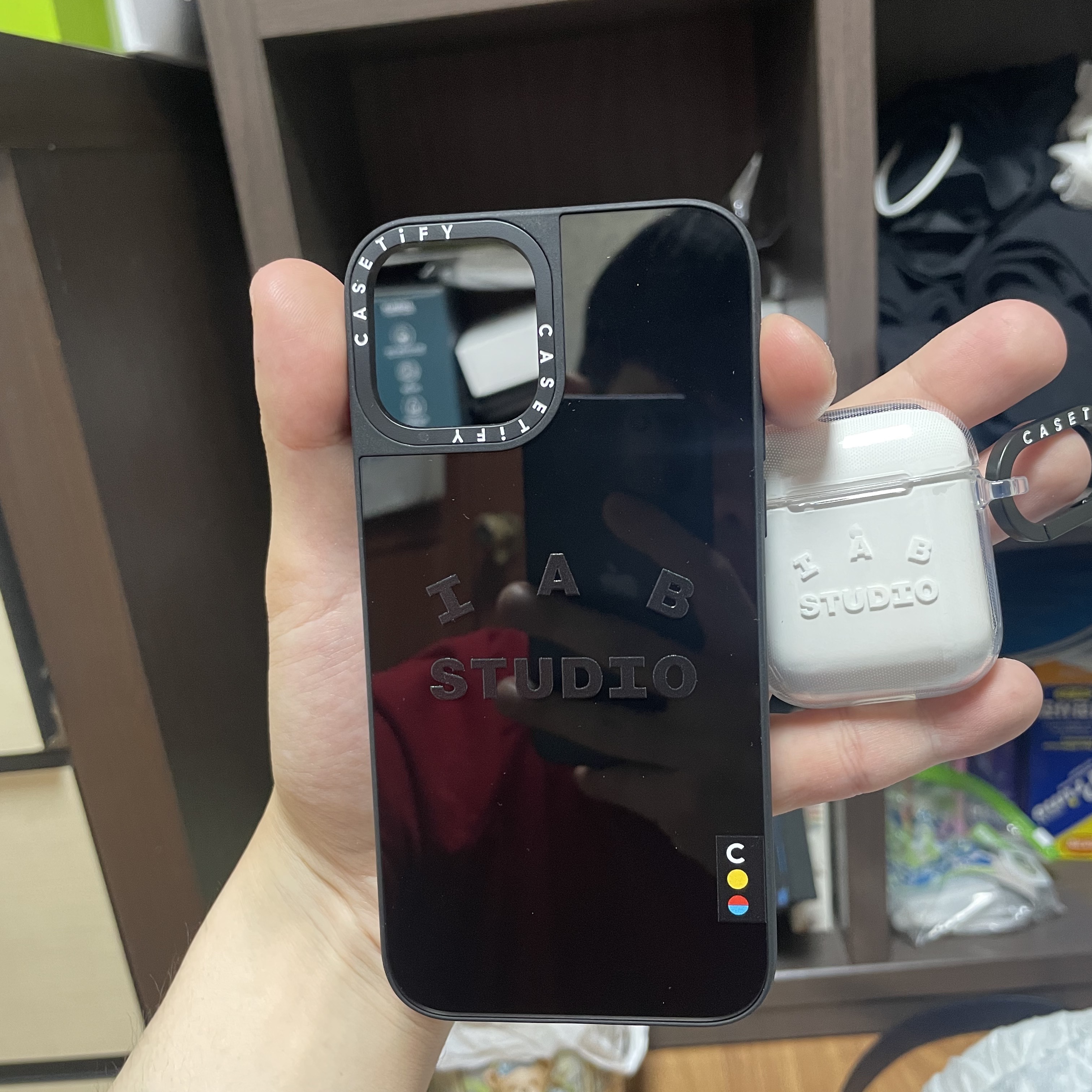Casetify x IAB Studio iPhone Black Logo MagSafe Mirror Case Black, Casetify x IAB Studio Single White Logo AirPods 2nd Gen Case Clear 착용 스타일