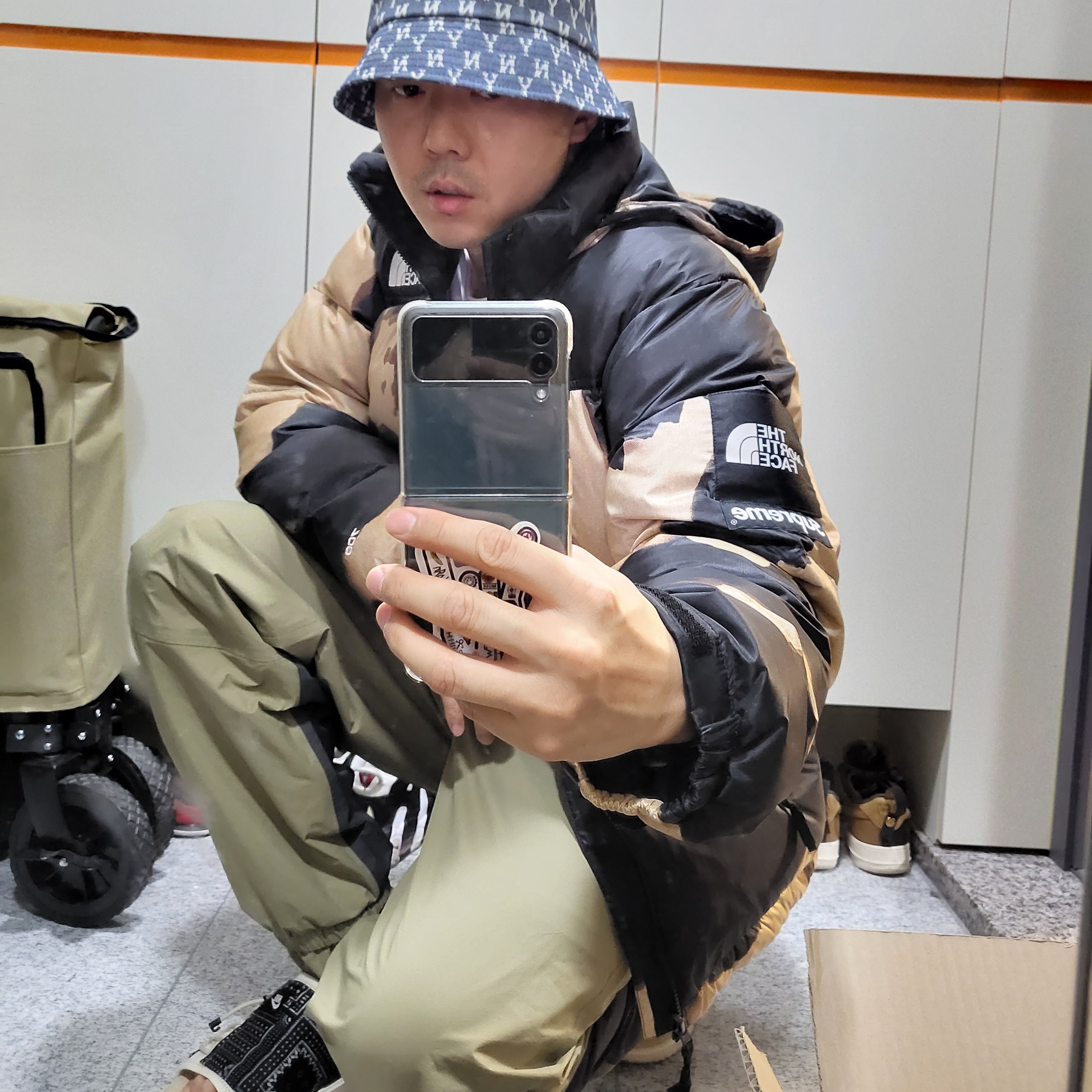 Supreme x The North Face Bleached Denim Print Nuptse Jacket Black - 21FW 착용 스타일