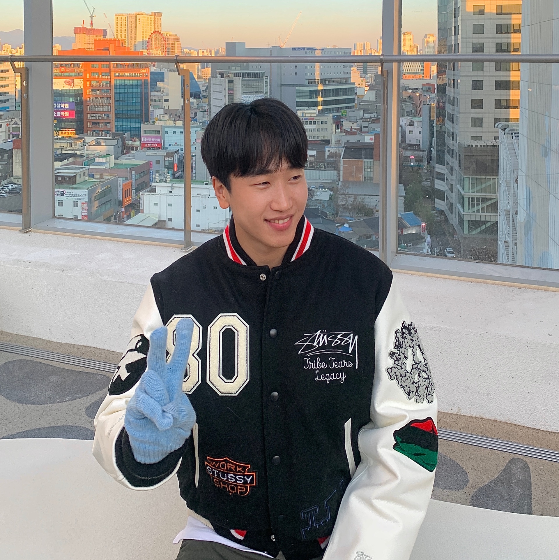 Stussy x Our Legacy x Denim Tears TTL Varsity Jacket Black, Stussy Curly S Sweater Natural 착용 스타일 - 1