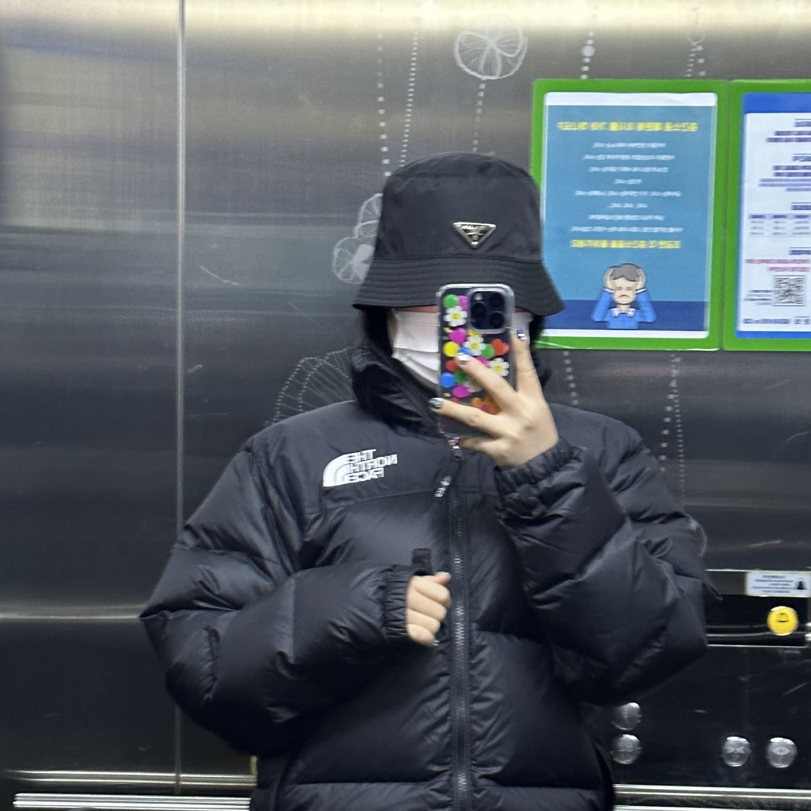 The North Face 1996 Eco Nuptse Jacket Black, Prada Re-Nylon Bucket Hat Black 착용 스타일