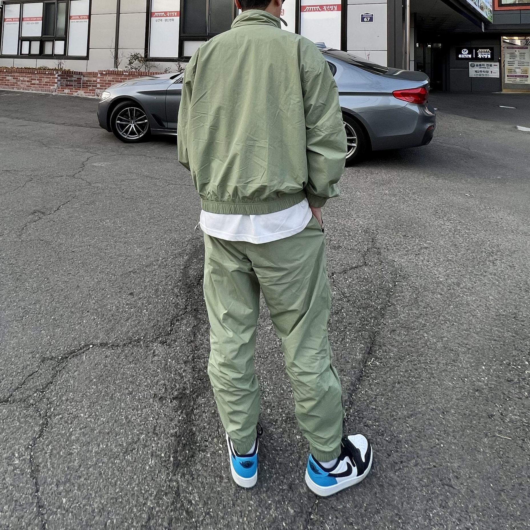 Jordan 1 Retro Low OG Black and Dark Powder Blue, Nike NRG Solo Swoosh Woven Track Jacket Oil Green - Asia 착용 스타일