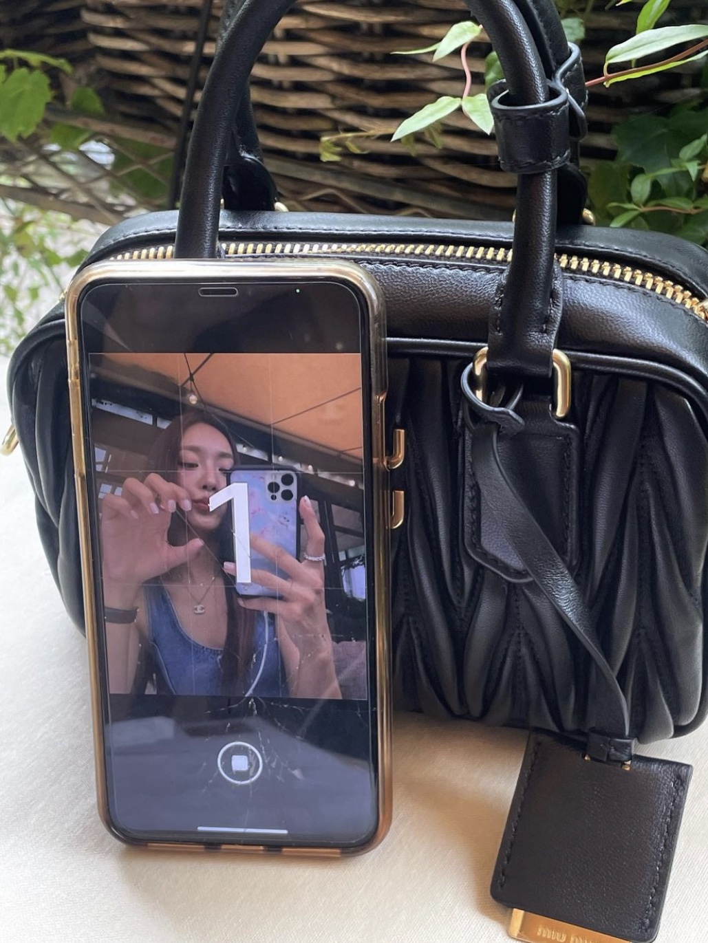 Miu Miu Matelasse Nappa Leather Top Handle Bag Black 착용 스타일