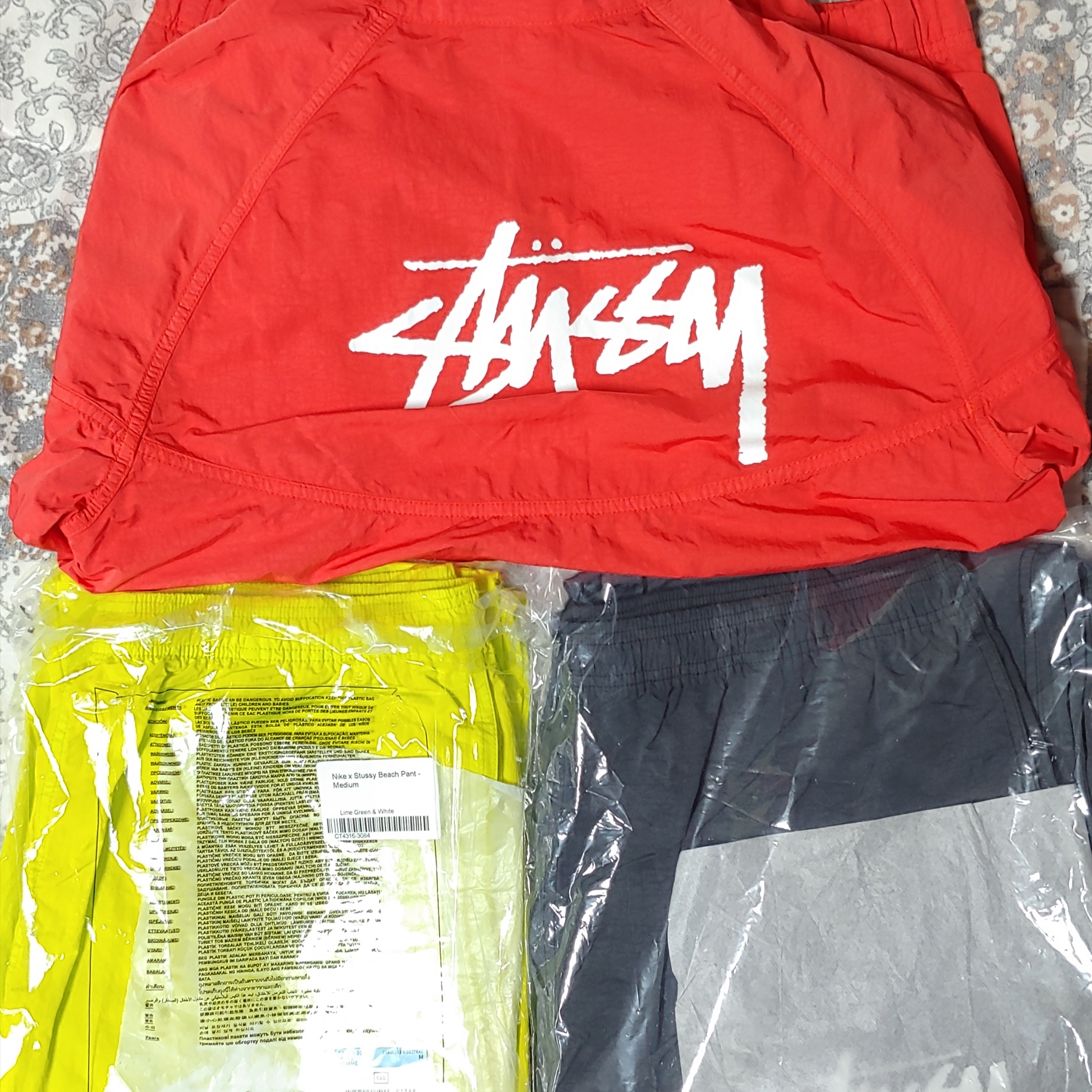 Nike x Stussy Windrunner Jacket Habanero Red, Nike x Stussy Beach Pants Off Noir 착용 스타일