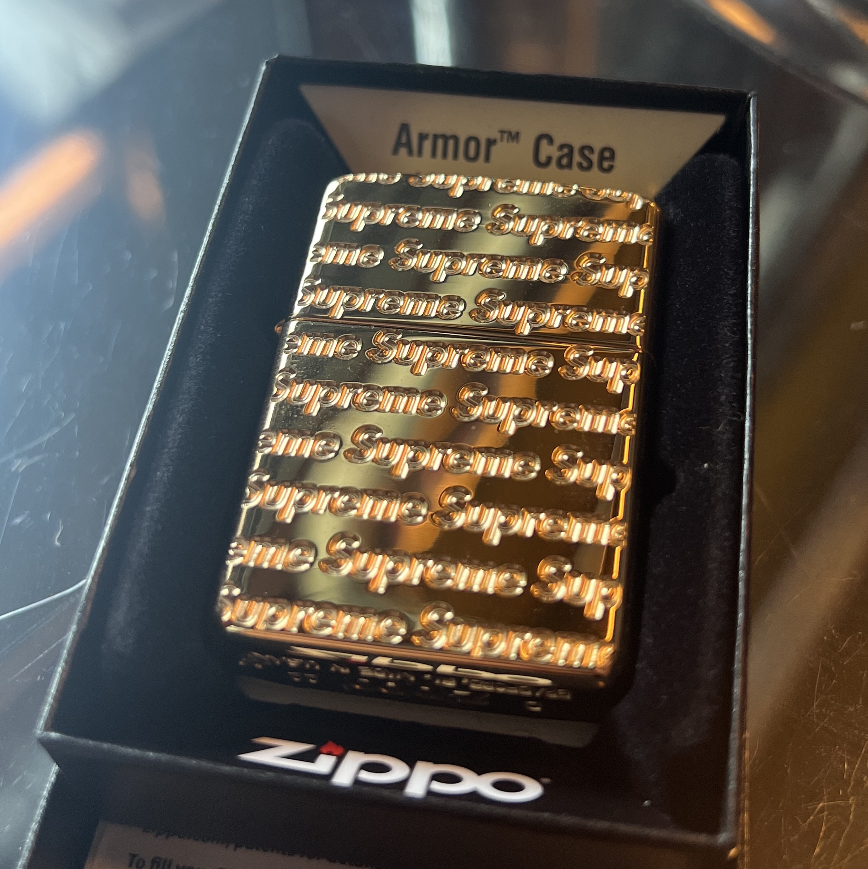 Supreme Repeat Engraved Zippo Gold - 22FW 착용 스타일