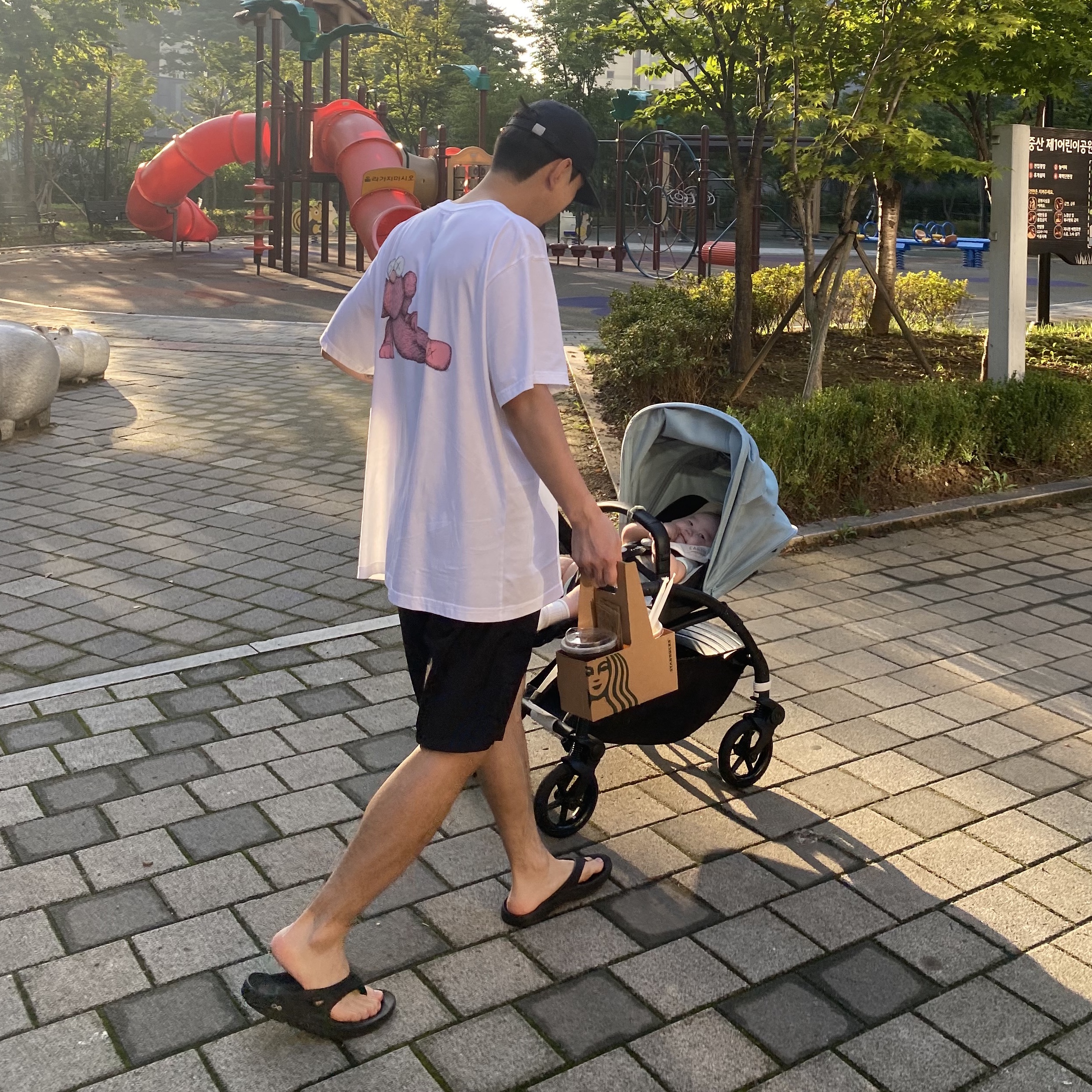 Uniqlo UT x Kaws Short Sleeve Graphic T-Shirt White, IAB Studio Summer Shorts Black 착용 스타일