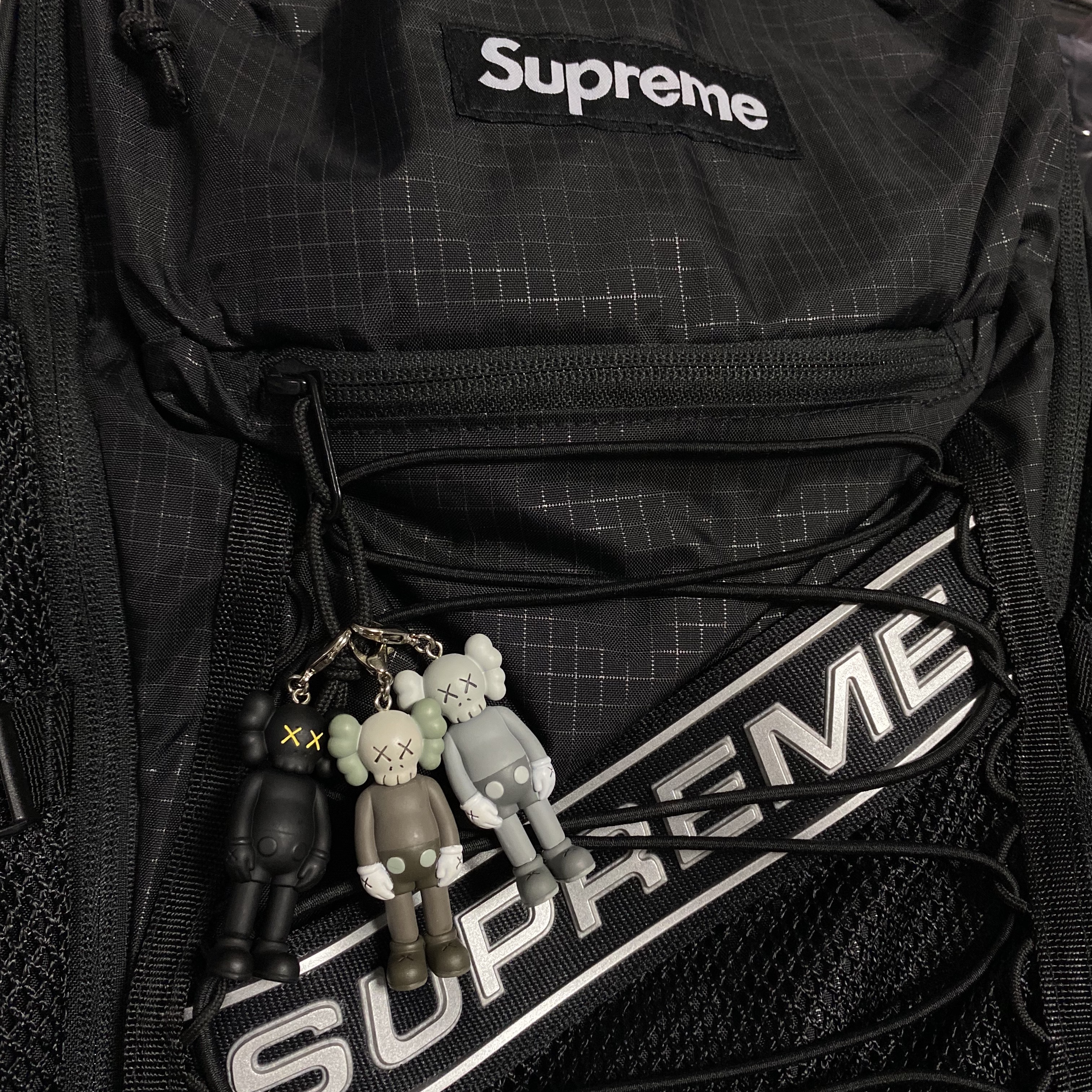 Kaws Tokyo First Companion Keychain (Set of 3), Supreme Backpack Black - 23FW 착용 스타일