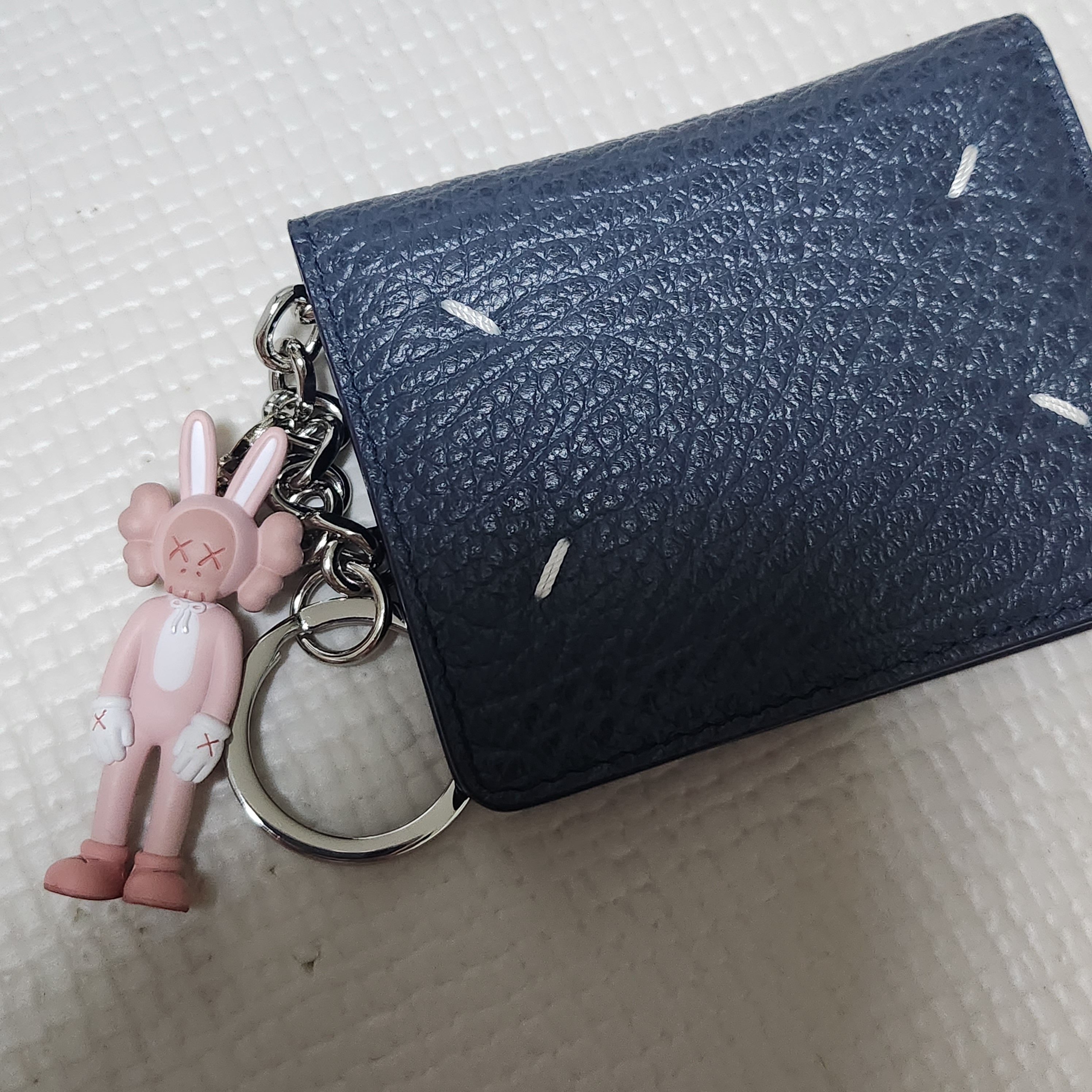 Kaws Tokyo First Accomplice Keychain Pink 착용 스타일