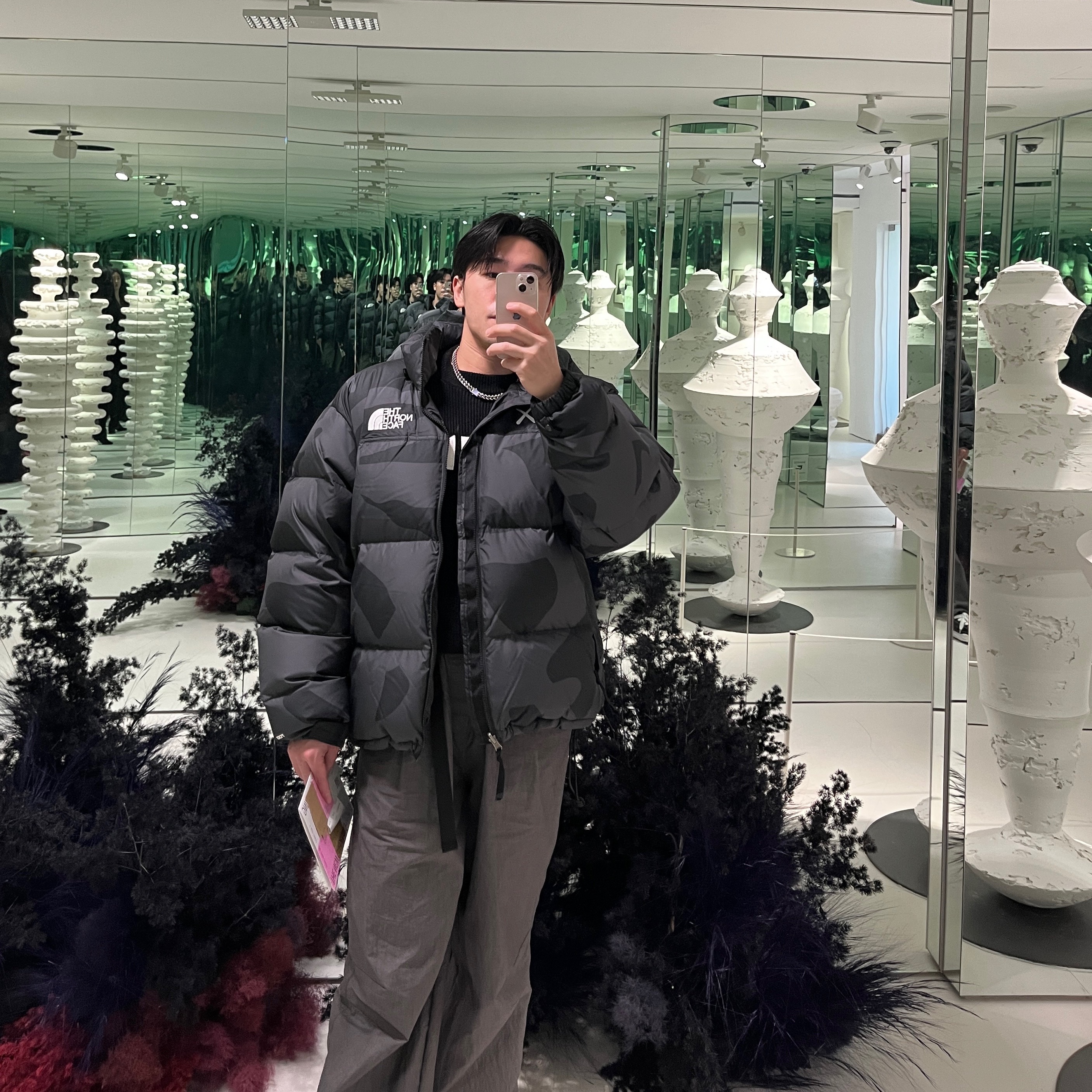 The North Face x Kaws Retro 1996 Nuptse Jacket Black Print - 22FW 착용 스타일