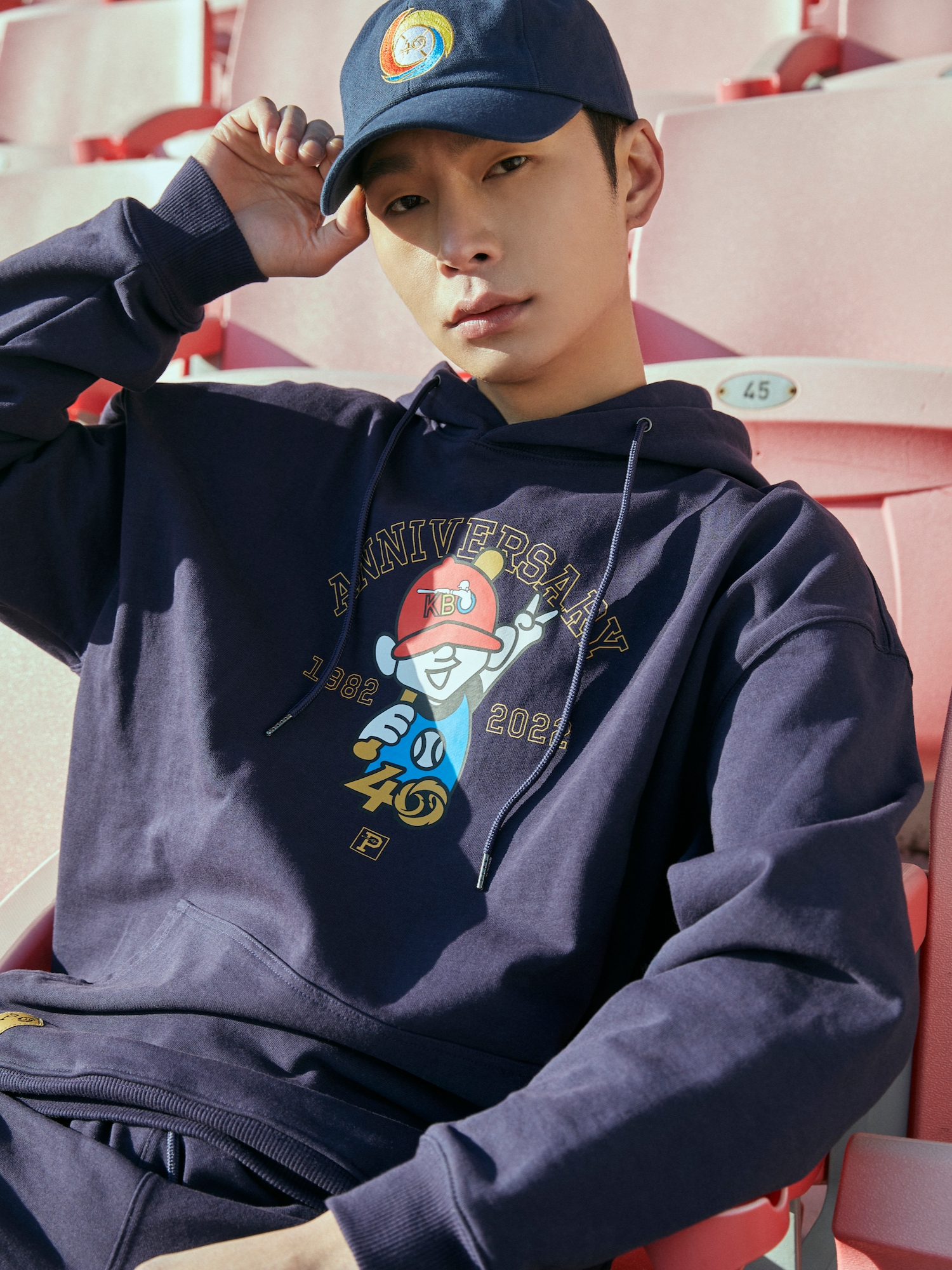 [KREAM 단독] Over The Pitch x KBO The 40th Anniversary Character Logo Regular Fit Hoodie Navy, [KREAM 단독] Over The Pitch x KBO The 40th Anniversary Emblem Cap Navy 착용 스타일