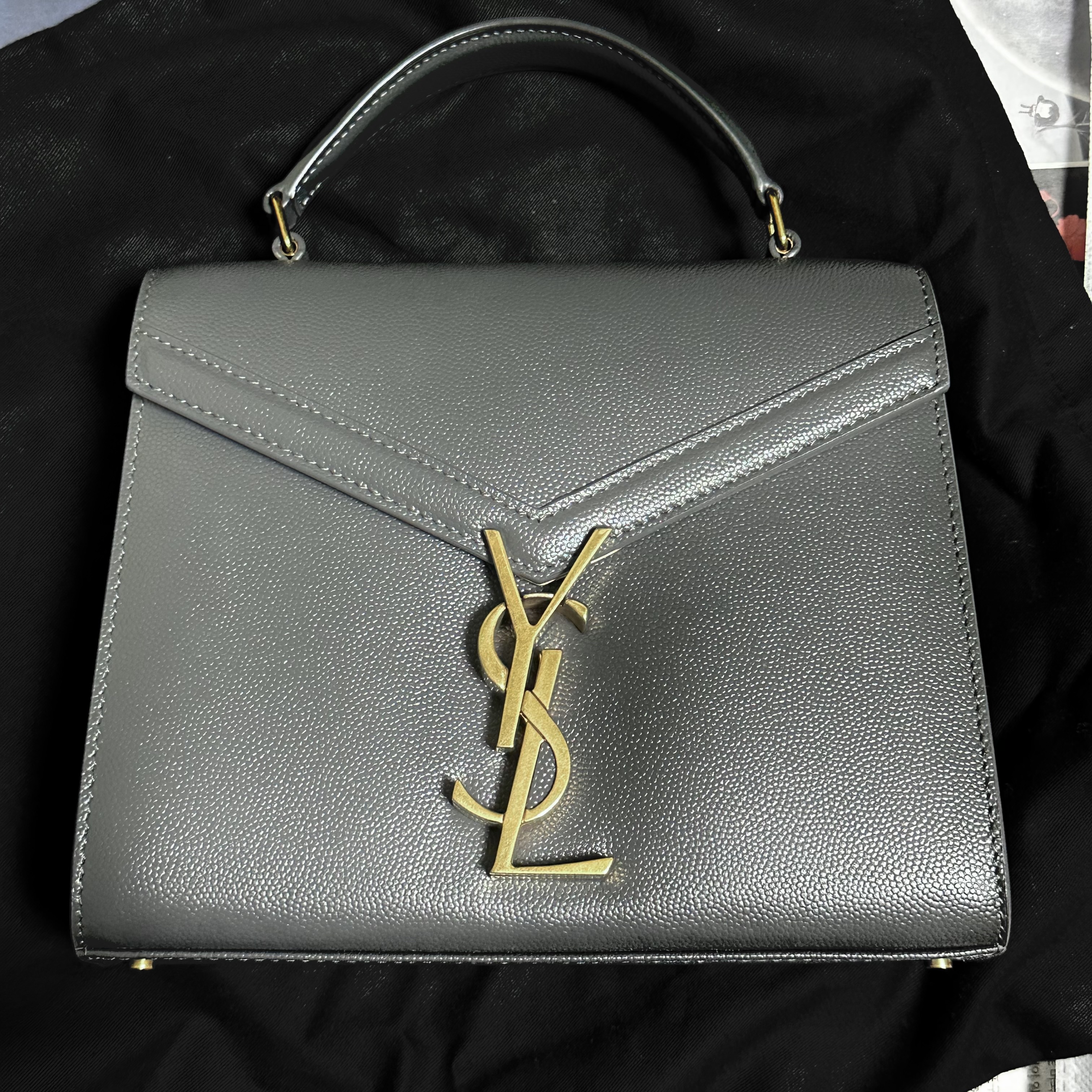 Saint Laurent Cassandra Mini Top Handle Bag in Grain de Poudre Embossed Leather Storm 착용 스타일