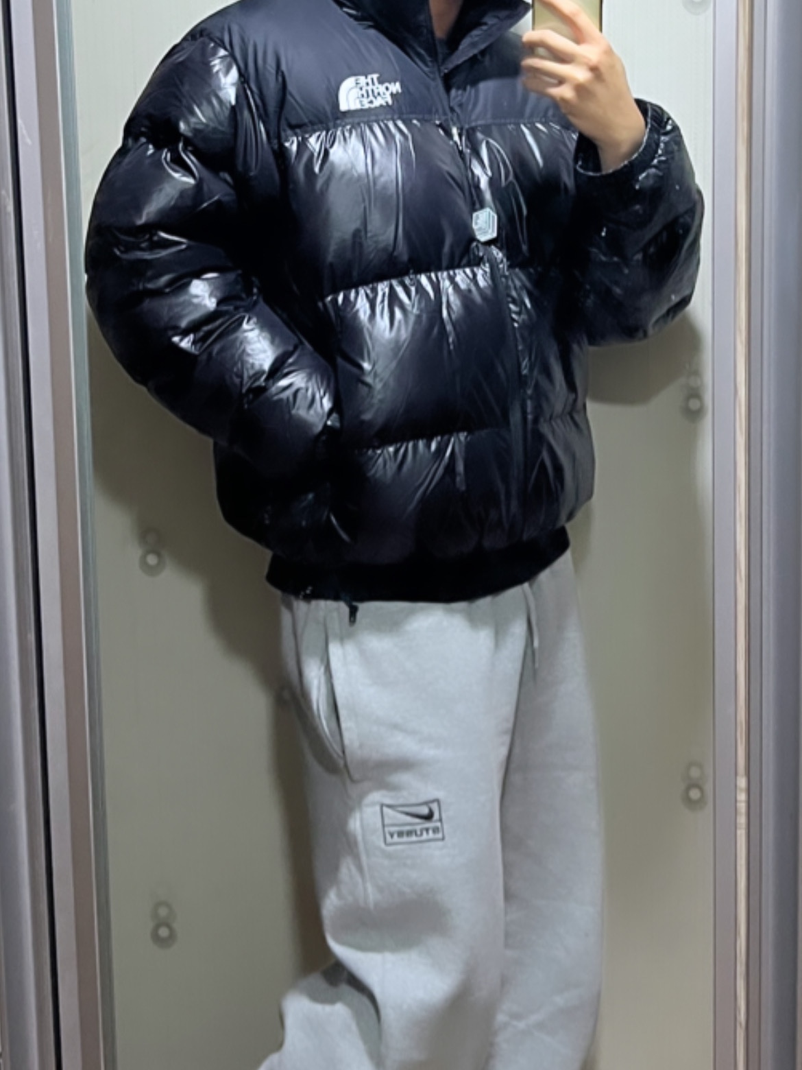 The North Face 1996 Eco Nuptse Jacket Real Black, Nike x Stussy NRG RA Fleece Pants Dark Grey Heather (DJ9490-063) 착용 스타일