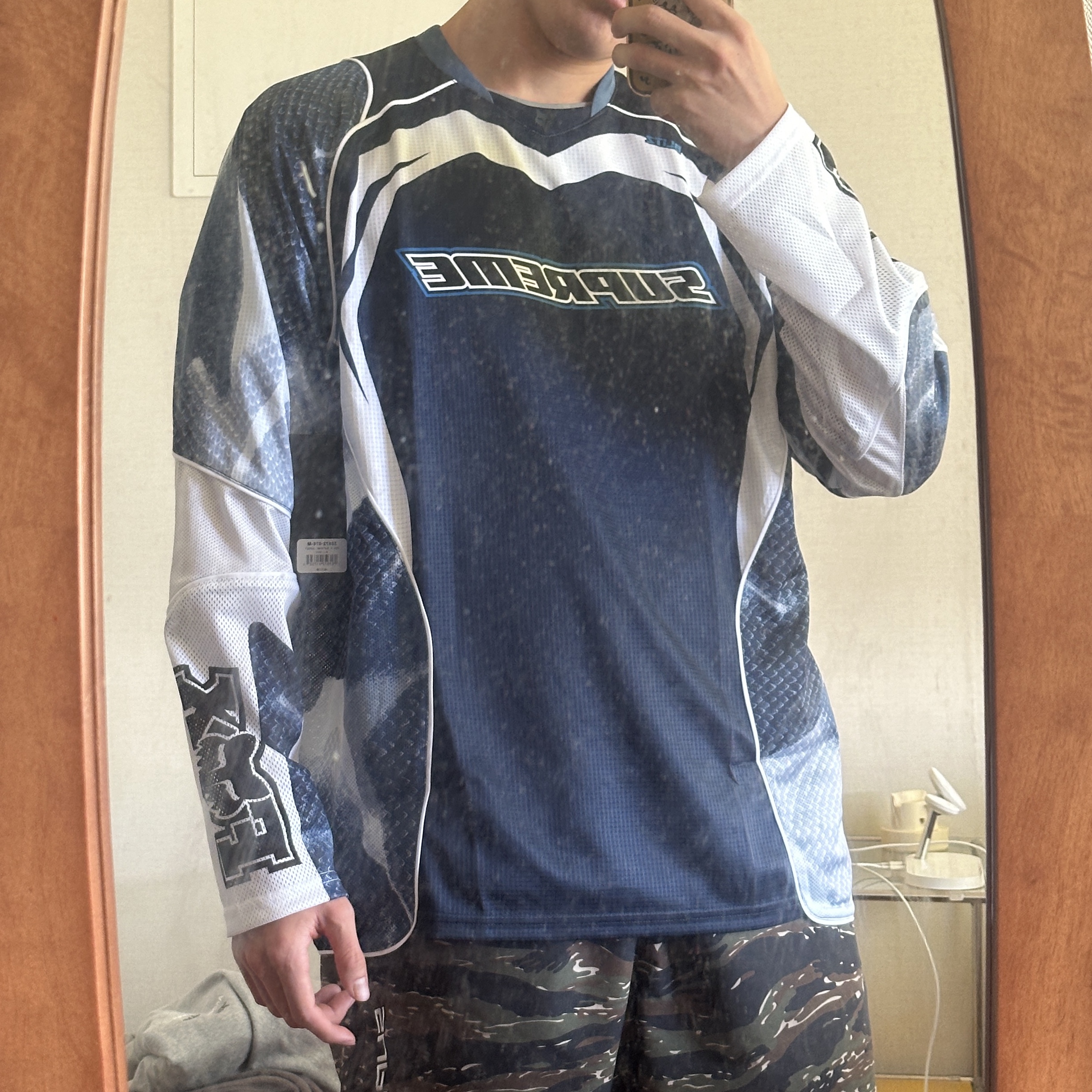 Supreme x Fox Racing Jersey Navy - 23FW, Supreme Full Zip Baggy Warm Up Pants Tiger Camo - 23SS 착용 스타일