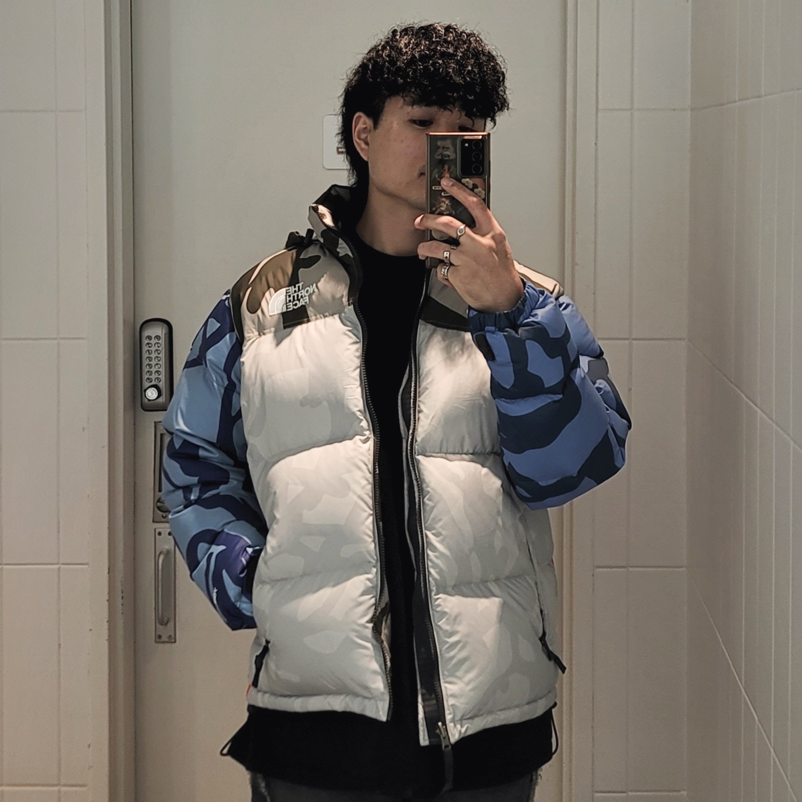 The North Face x Kaws 1996 Nuptse Jacket Moonlight Ivory 착용 스타일