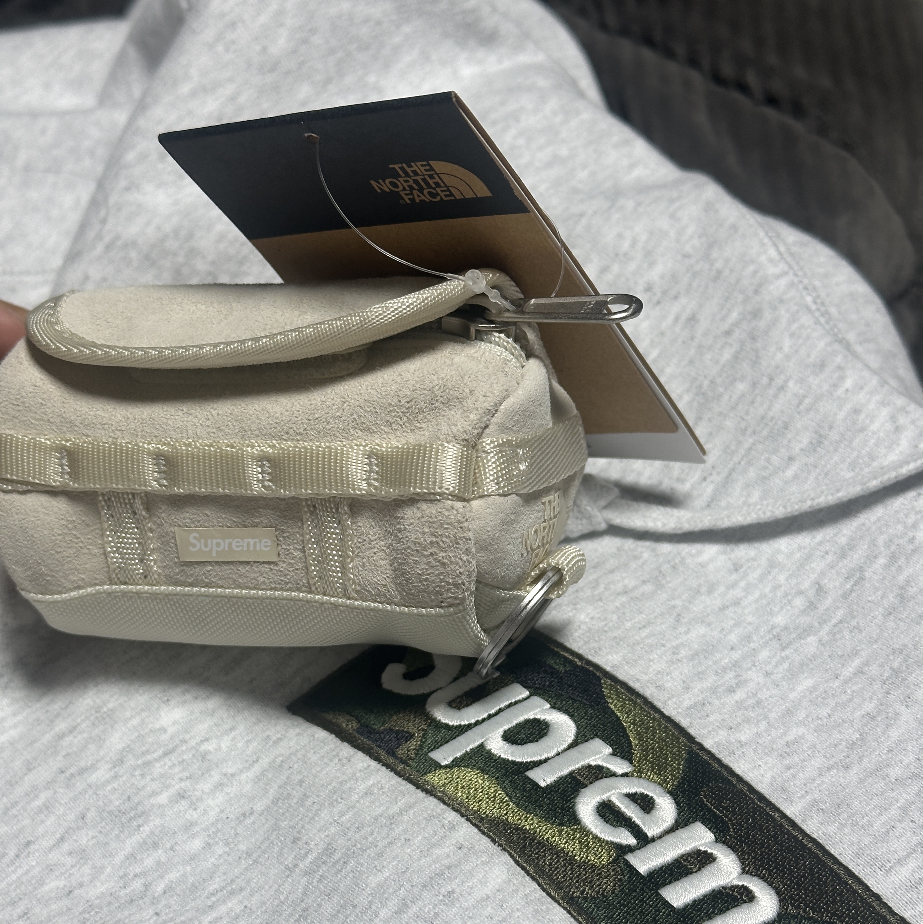 Supreme x The North Face Suede Base Camp Duffle Keychain Stone - 23FW, Supreme Box Logo Hooded Sweatshirt Ash Grey - 23FW 착용 스타일