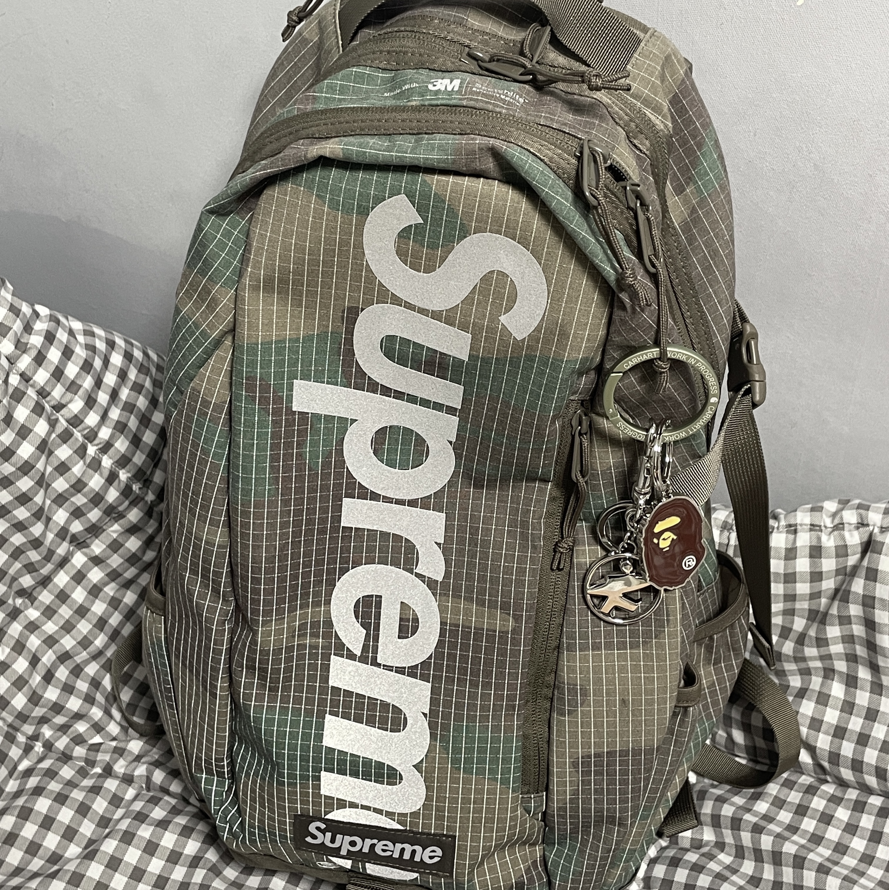 Supreme Backpack Woodland Camo - 24SS, BAPE Ape Head Metal Keychain Brown 착용 스타일