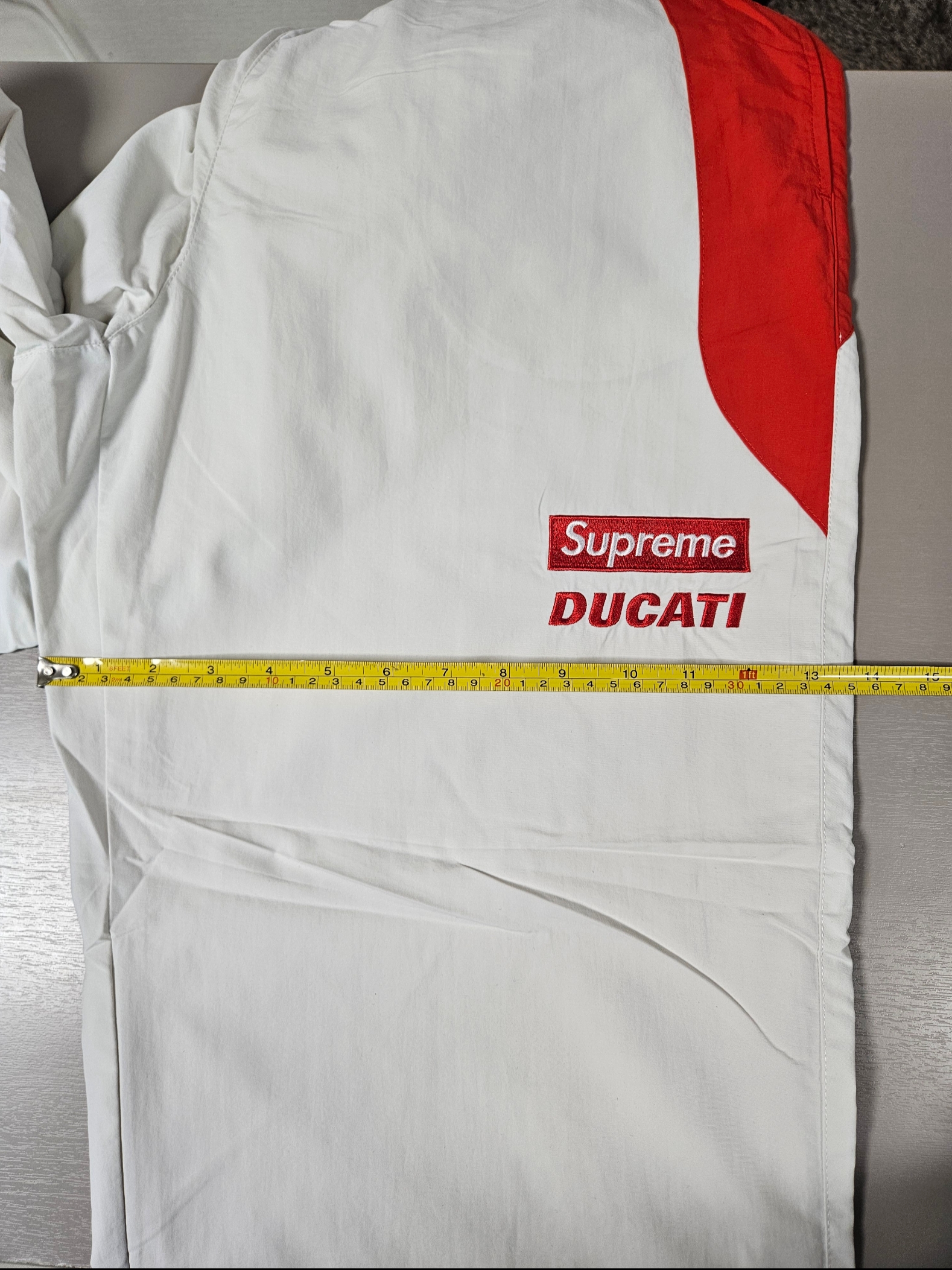 Supreme x Ducati Track Pants Light Grey - 24SS, Supreme x Ducati Logos T-Shirt Red - 24SS 착용 스타일 - 7