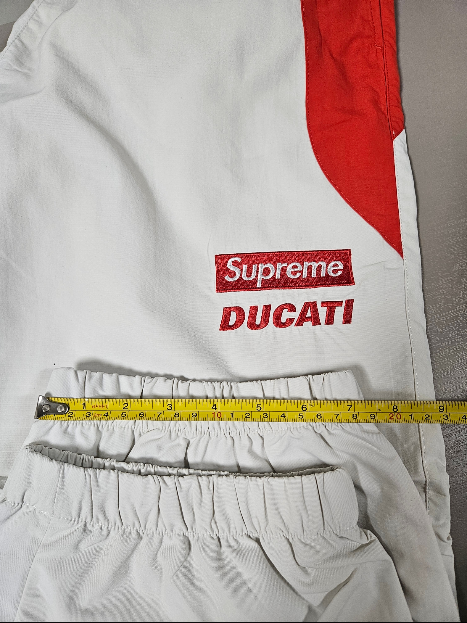 Supreme x Ducati Track Pants Light Grey - 24SS, Supreme x Ducati Logos T-Shirt Red - 24SS 착용 스타일 - 8