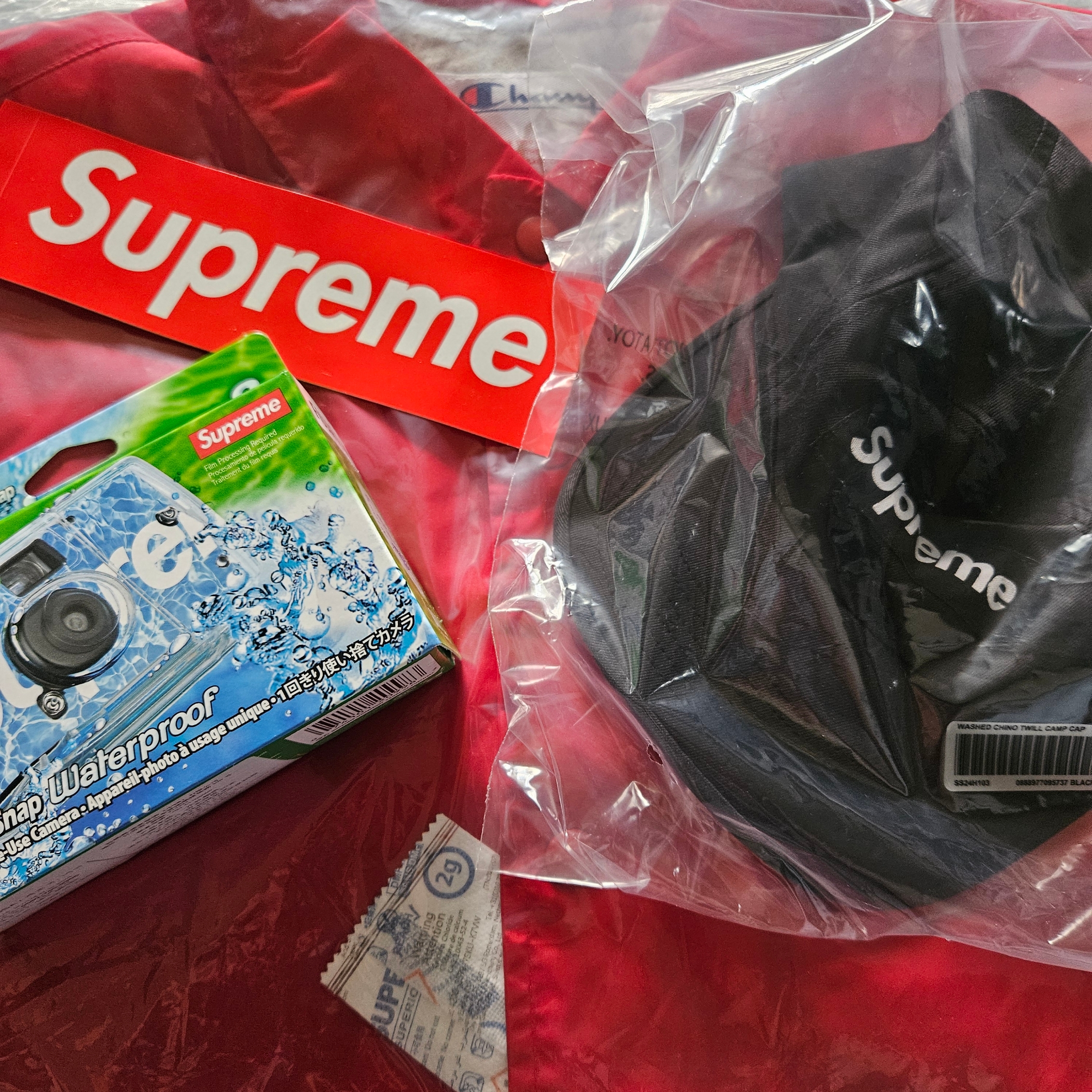 Supreme Washed Chino Twill Camp Cap Black - 24SS, Supreme x Champion Coaches Jacket Red - 24SS 착용 스타일