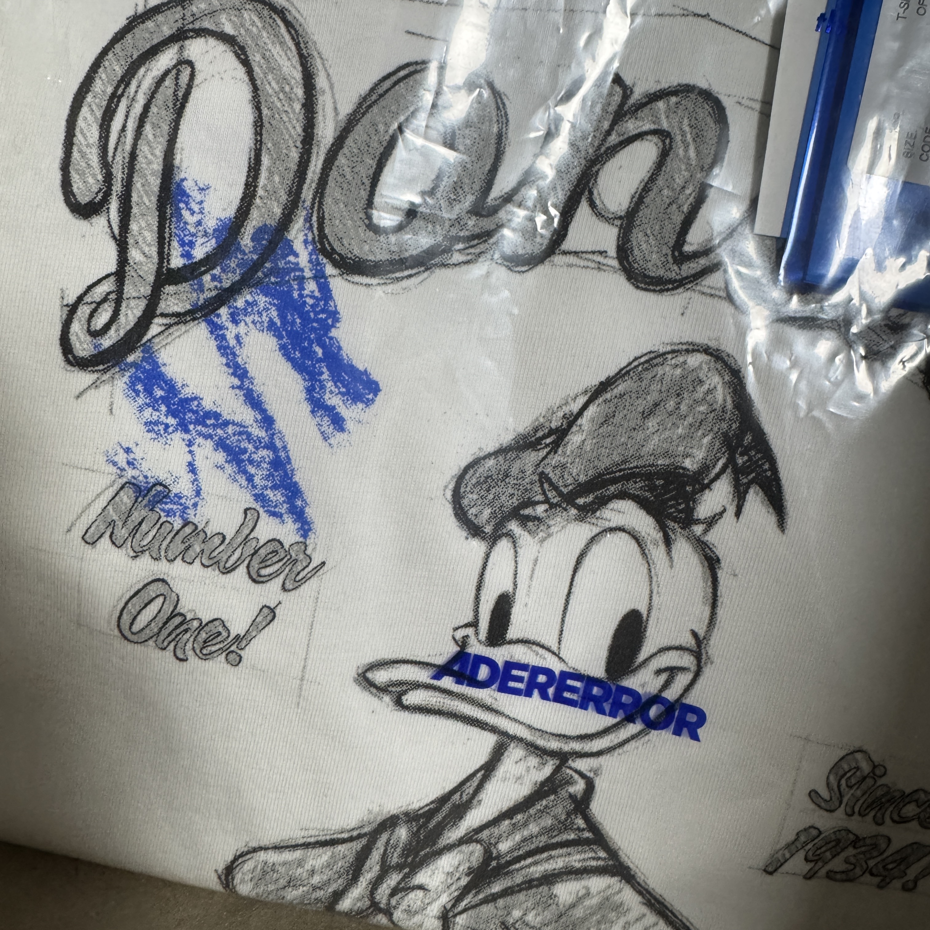 Ader Error x Disney Blue Easter Egg Game T-Shirt 01 Off White 착용 스타일
