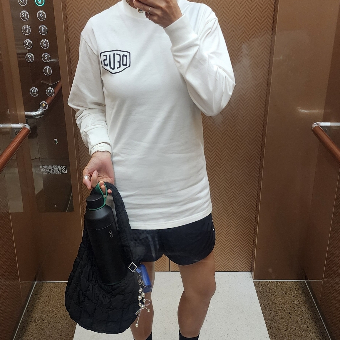 Deus Ex Machina Seoul College Long Sleeve T-Shirt White, Nike x Drake Nocta Nylon Woven Shorts Black (FN8194-010) 착용 스타일