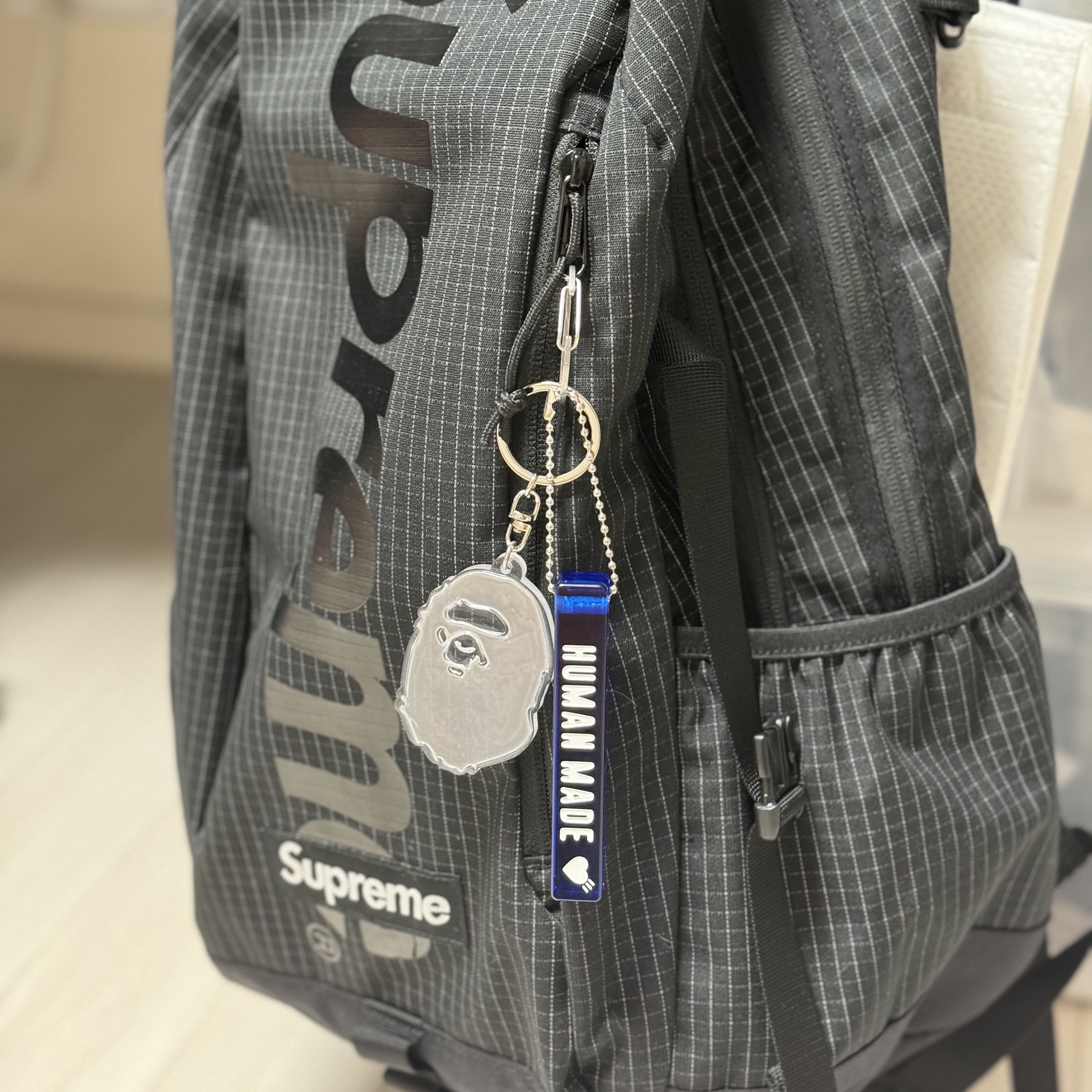 Supreme Backpack Black - 24SS, Human Made Acrylic Keychain Blue 착용 스타일