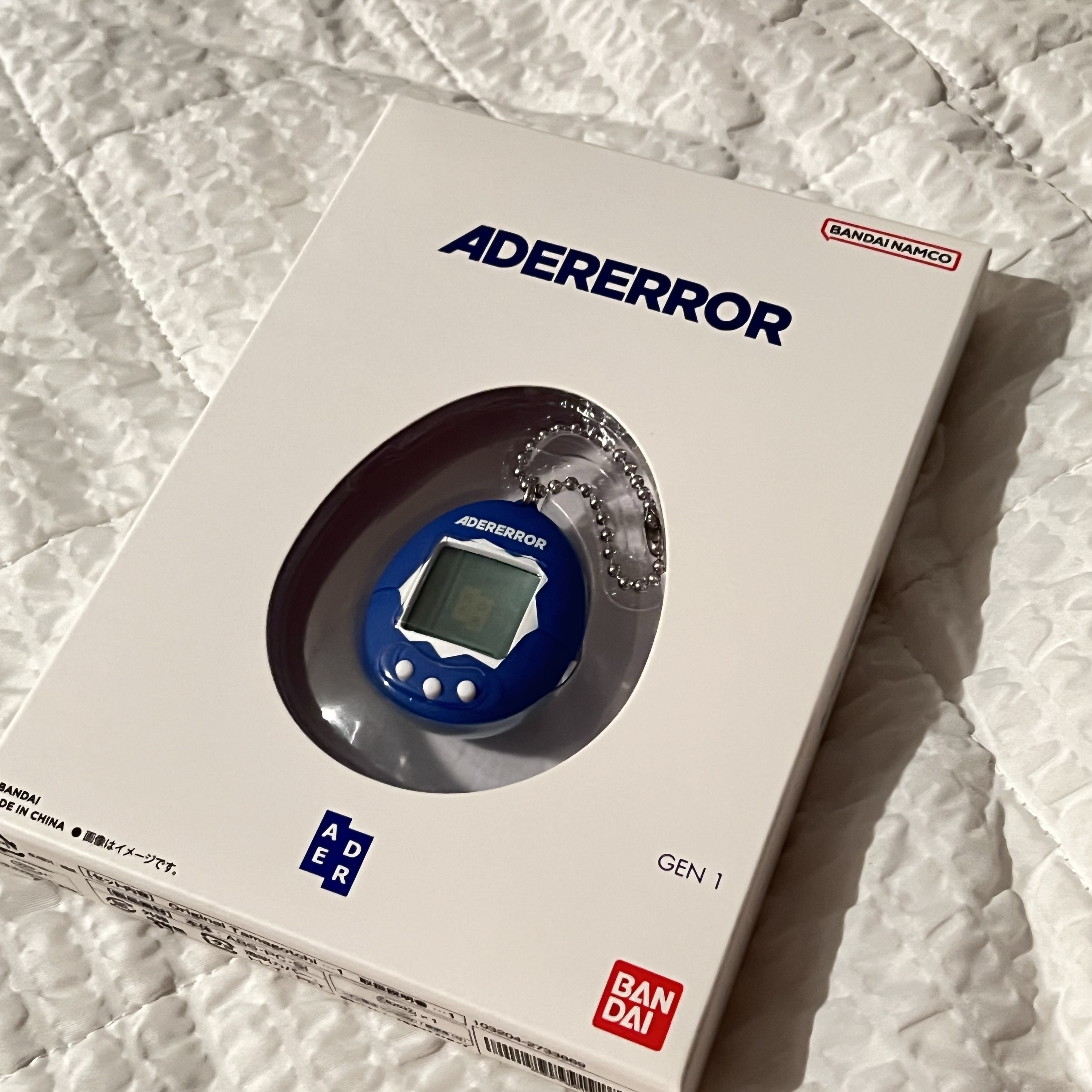 Ader Error x Bandai Original Tamagotchi Z-Blue 착용 스타일