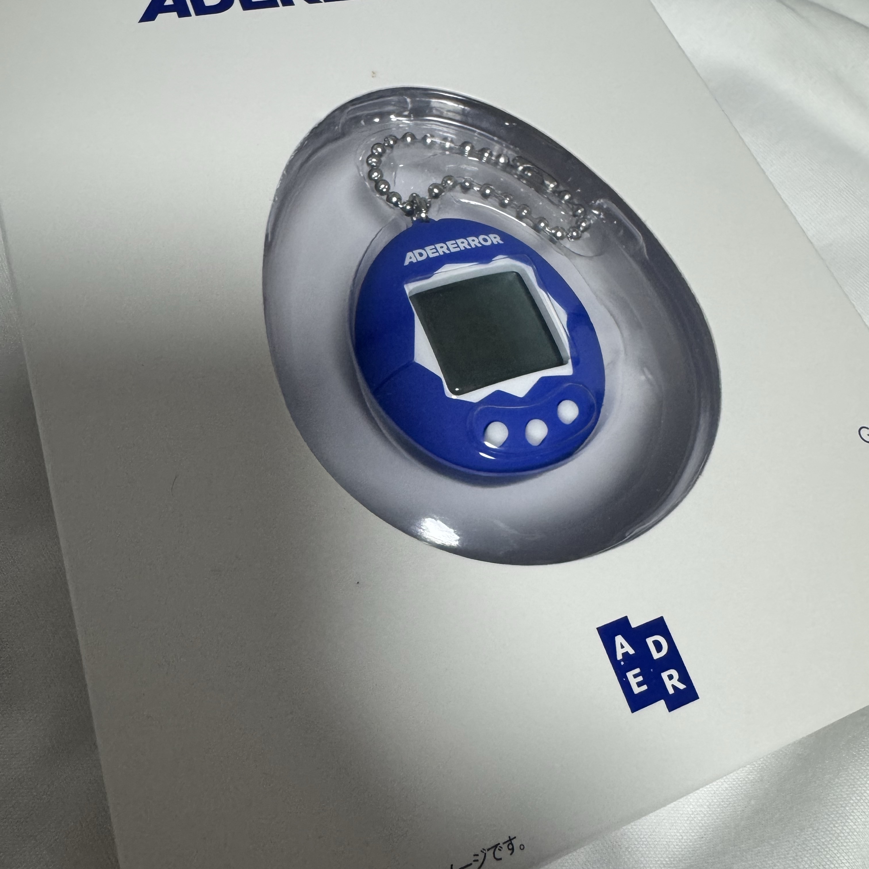 Ader Error x Bandai Original Tamagotchi Z-Blue 착용 스타일