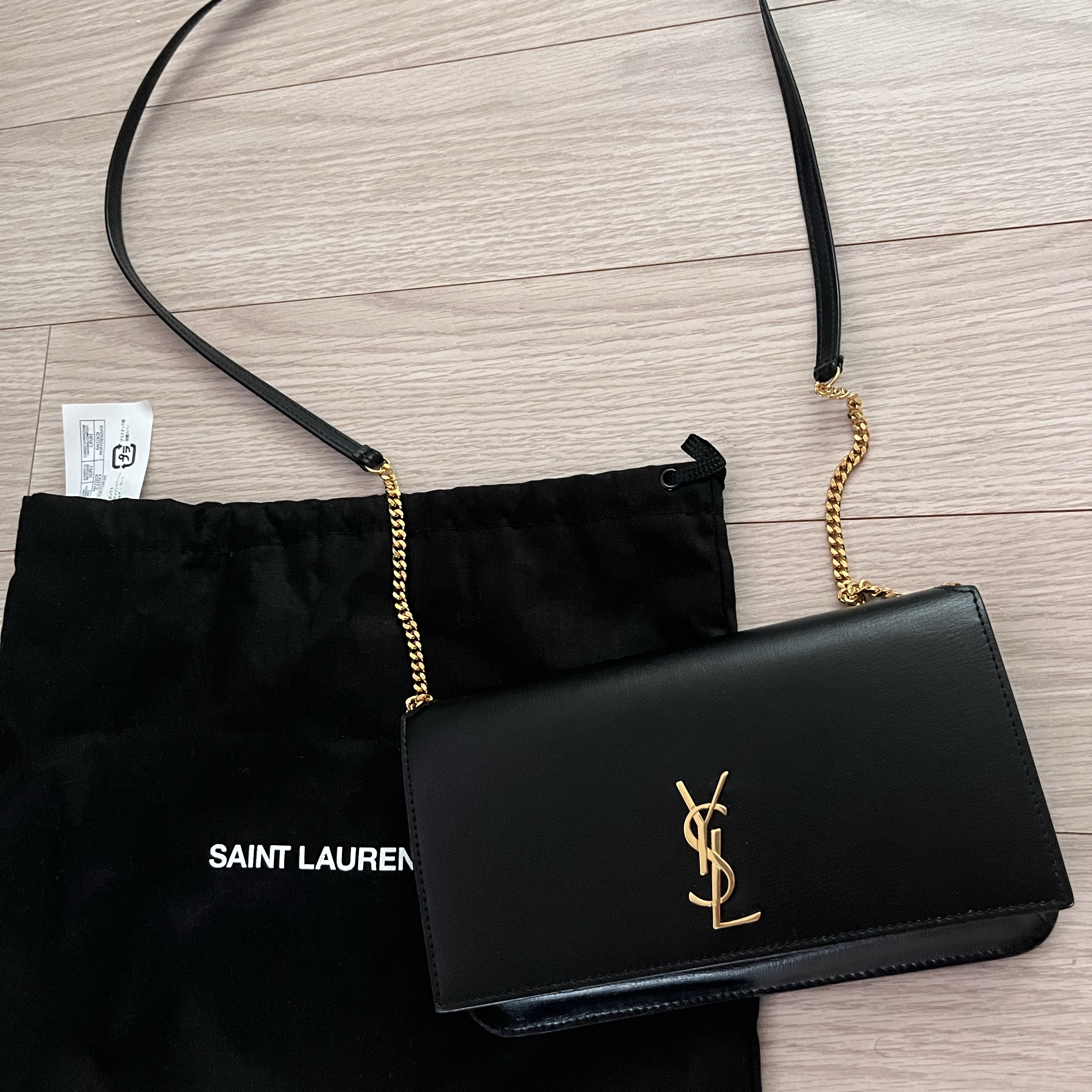 Saint Laurent Gold Monogram Phone Holder with Strap in Smooth Leather Black 착용 스타일