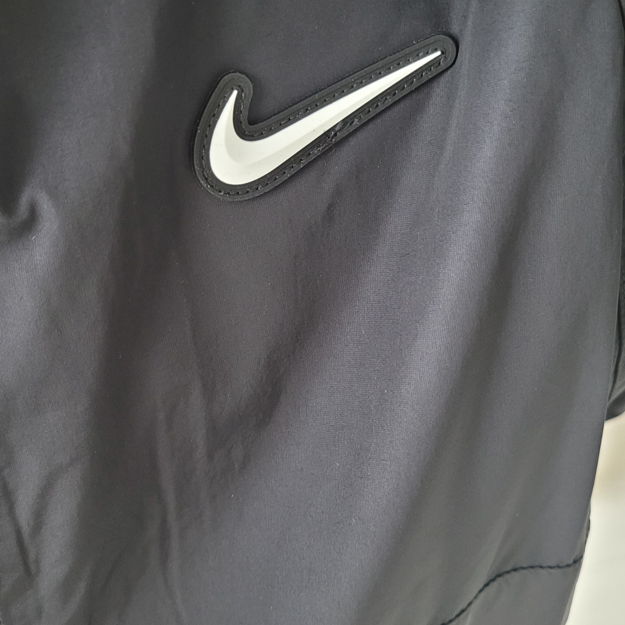 Nike x Drake Nocta Nylon Track Jacket Black (FN7666-010) 착용 스타일 - 1