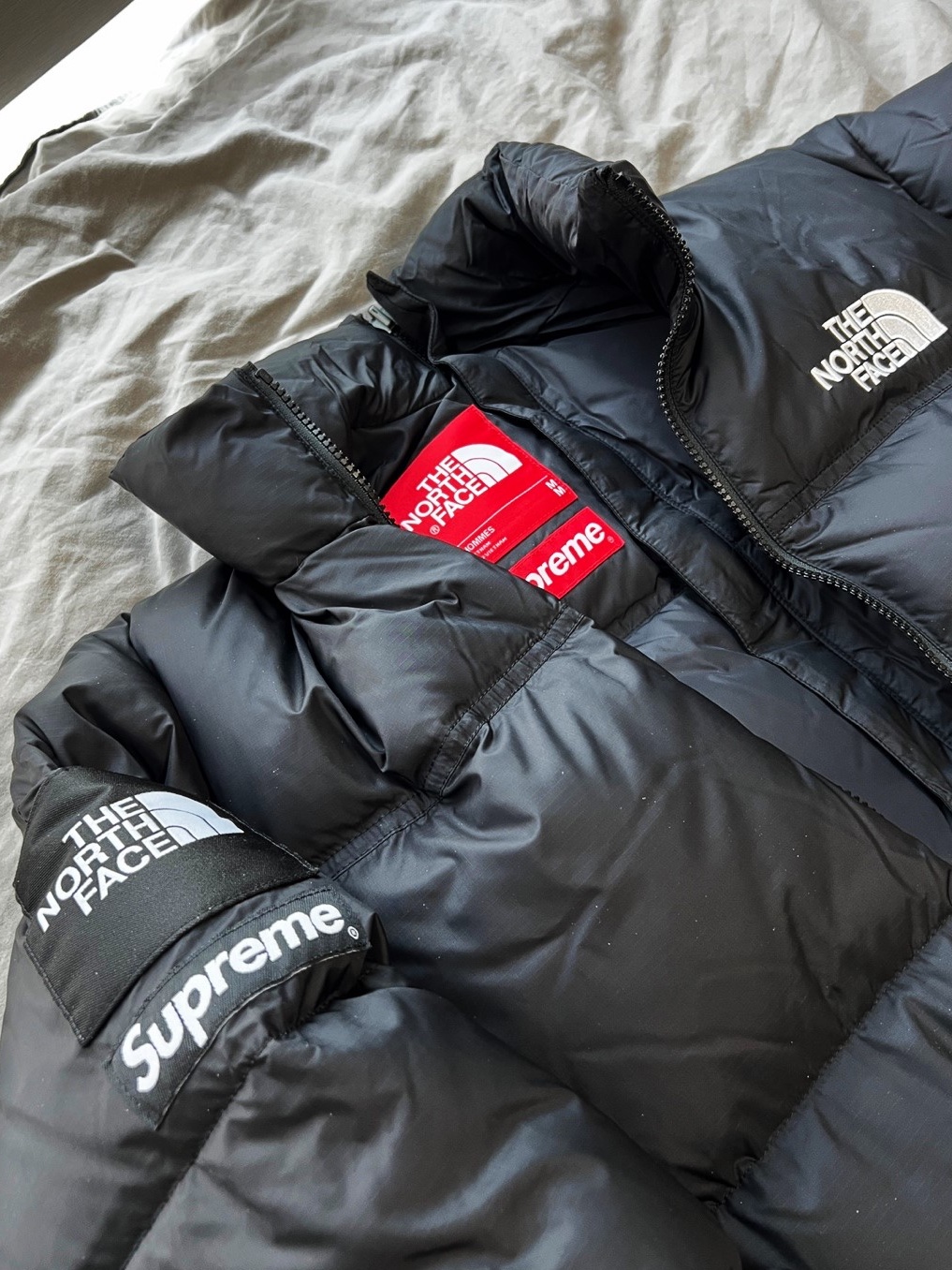 Supreme x The North Face Split Nuptse Jacket Black - 24SS 착용 스타일