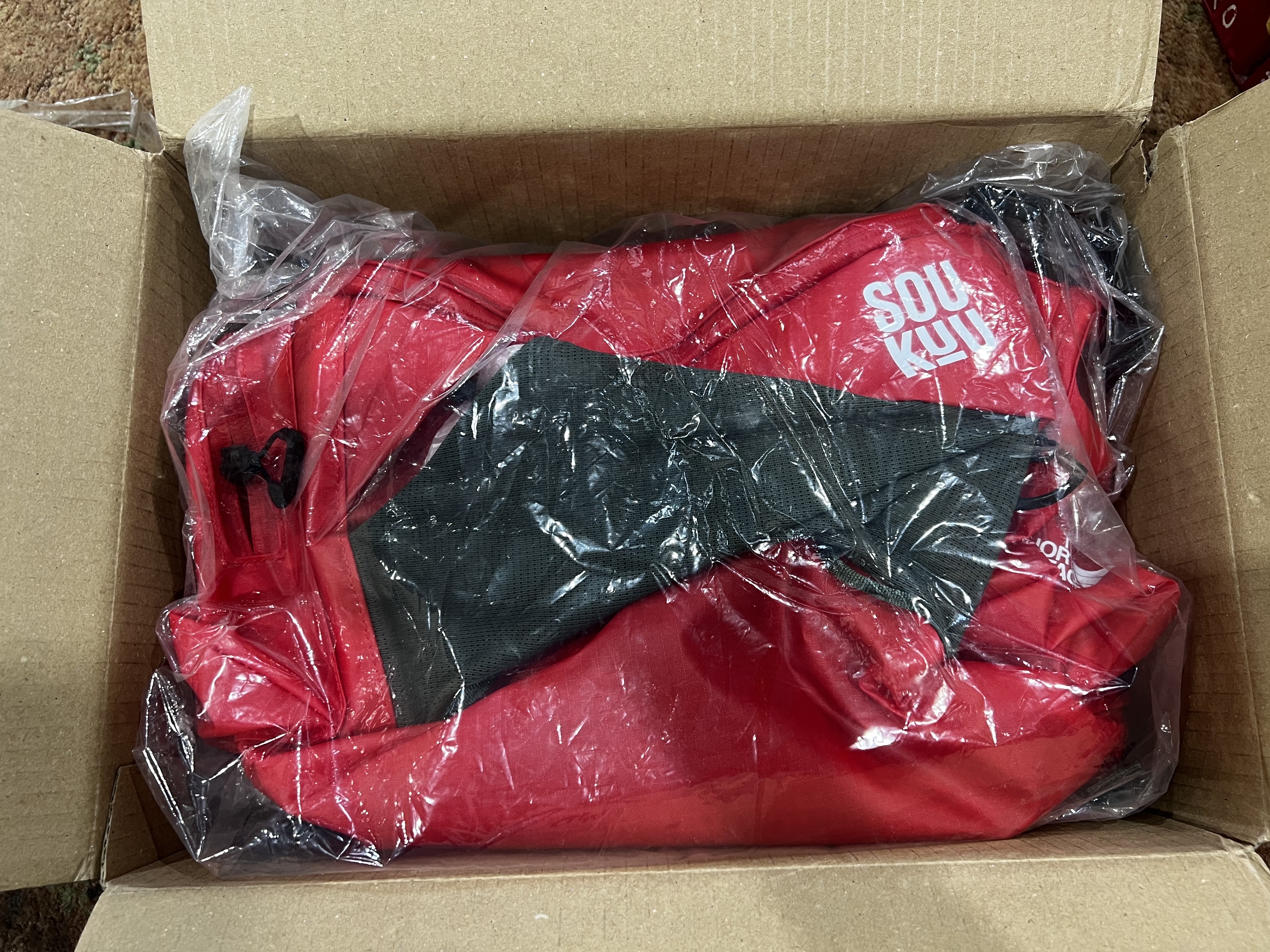 The North Face x Undercover Soukuu Waistpack Dark Cedar Green High Risk Red 착용 스타일