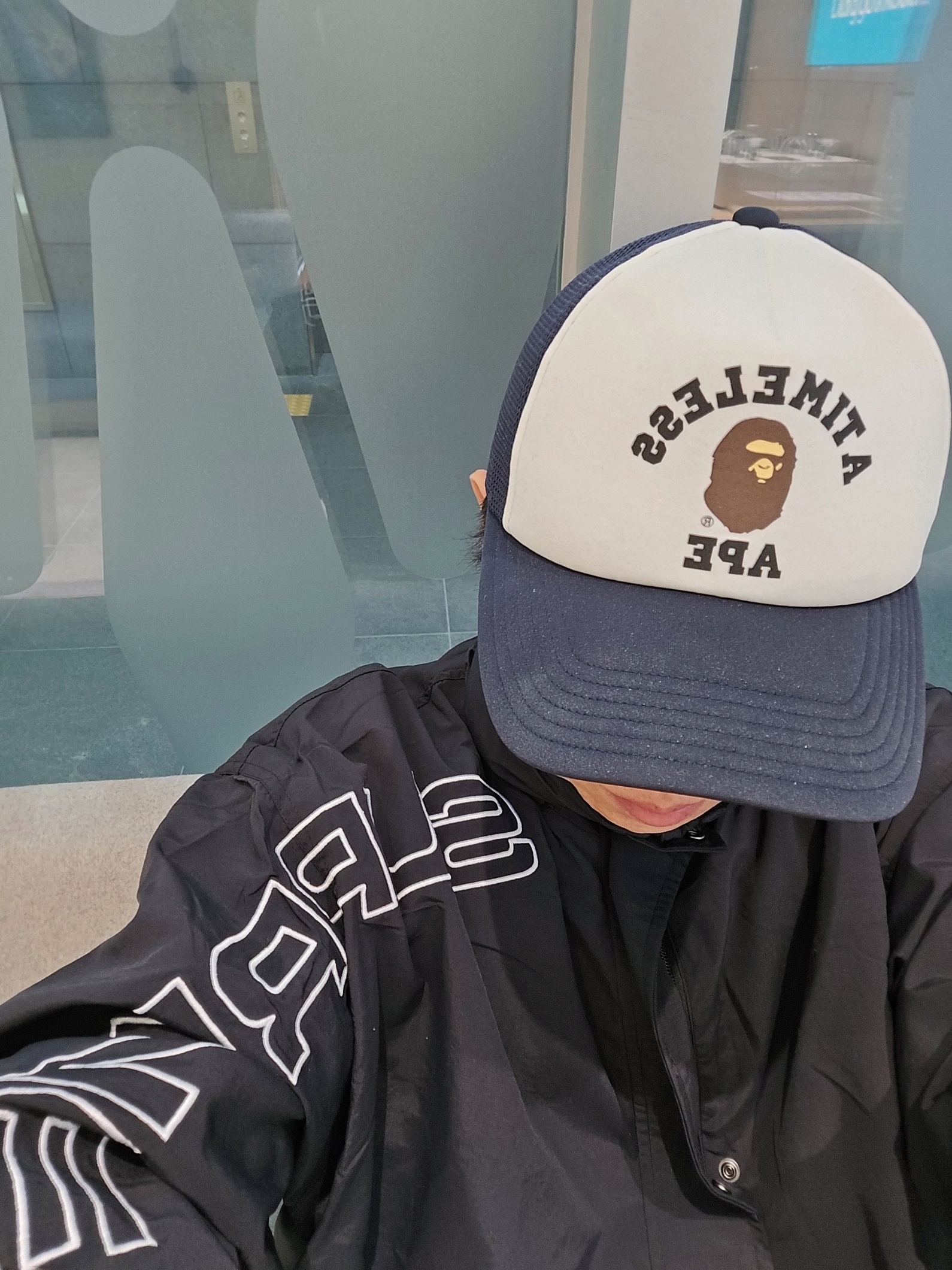 BAPE x JJJJound College Mesh Cap White Navy, Supreme Spellout Embroidered Track Jacket Black - 24FW 착용 스타일