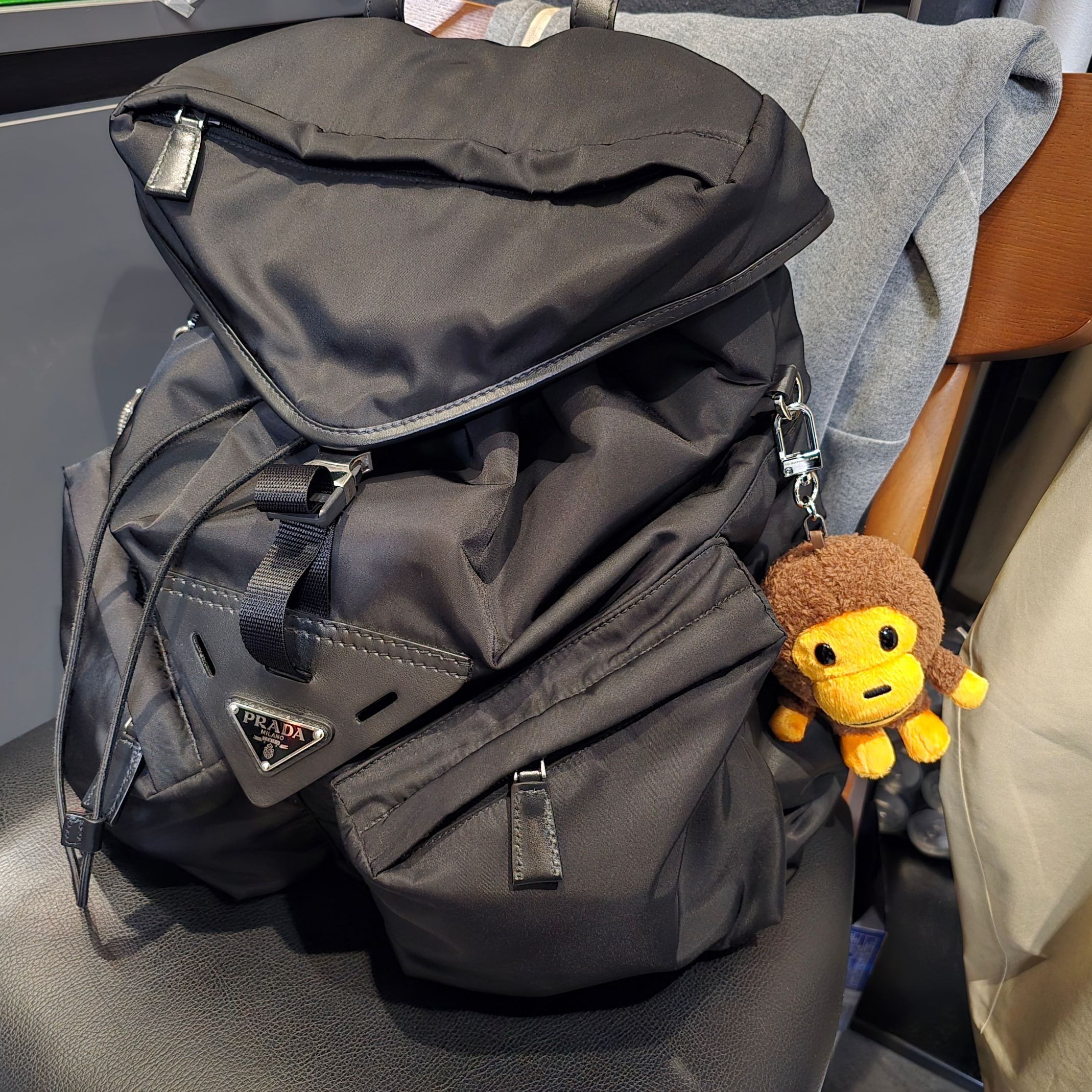 BAPE Baby Milo Plush Doll Key Chain 12cm Brown, Prada Re-Nylon Leather Backpack Black 착용 스타일