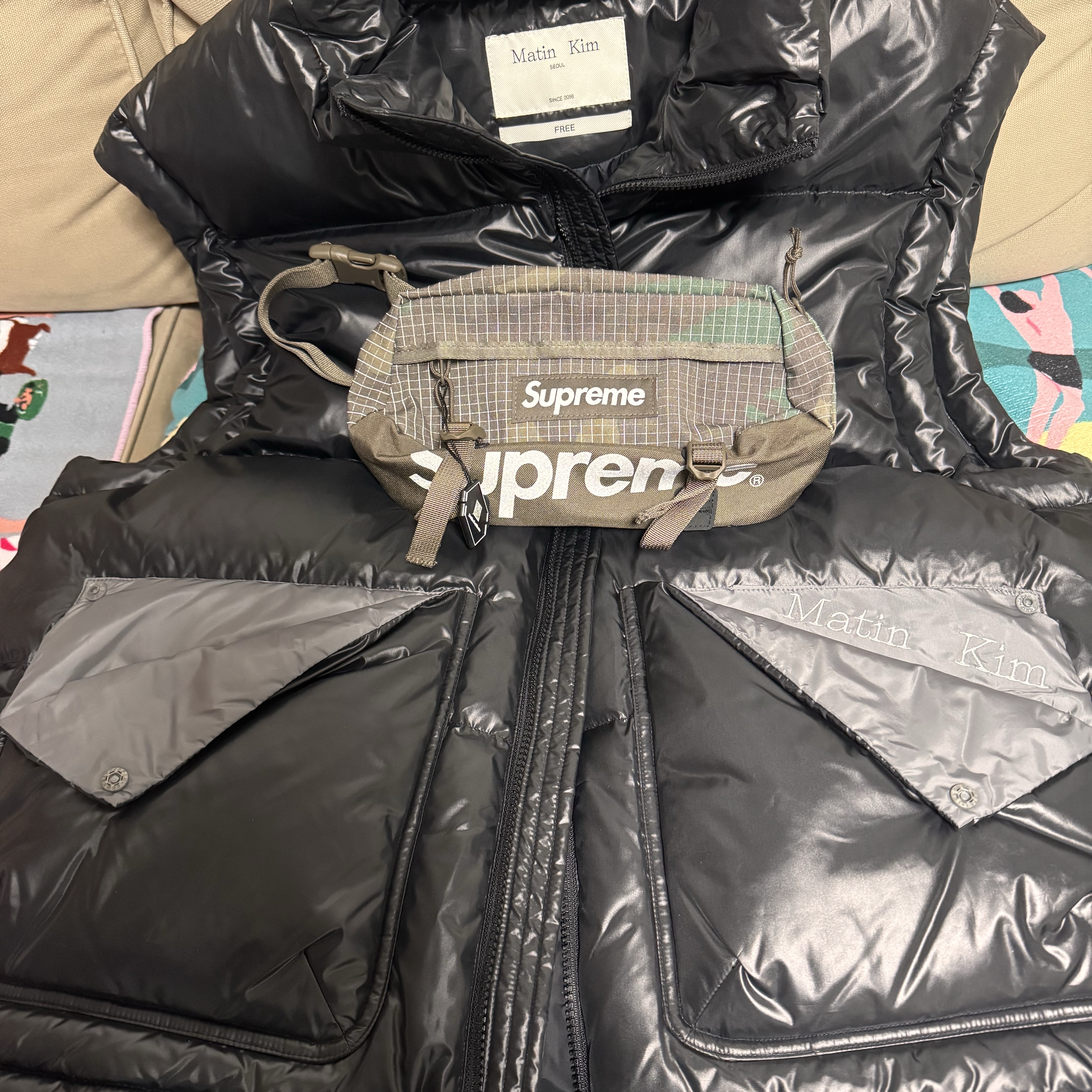 Matin Kim Folded Pocket Down Vest Black, Supreme Waist Bag Woodland Camo - 24SS 착용 스타일