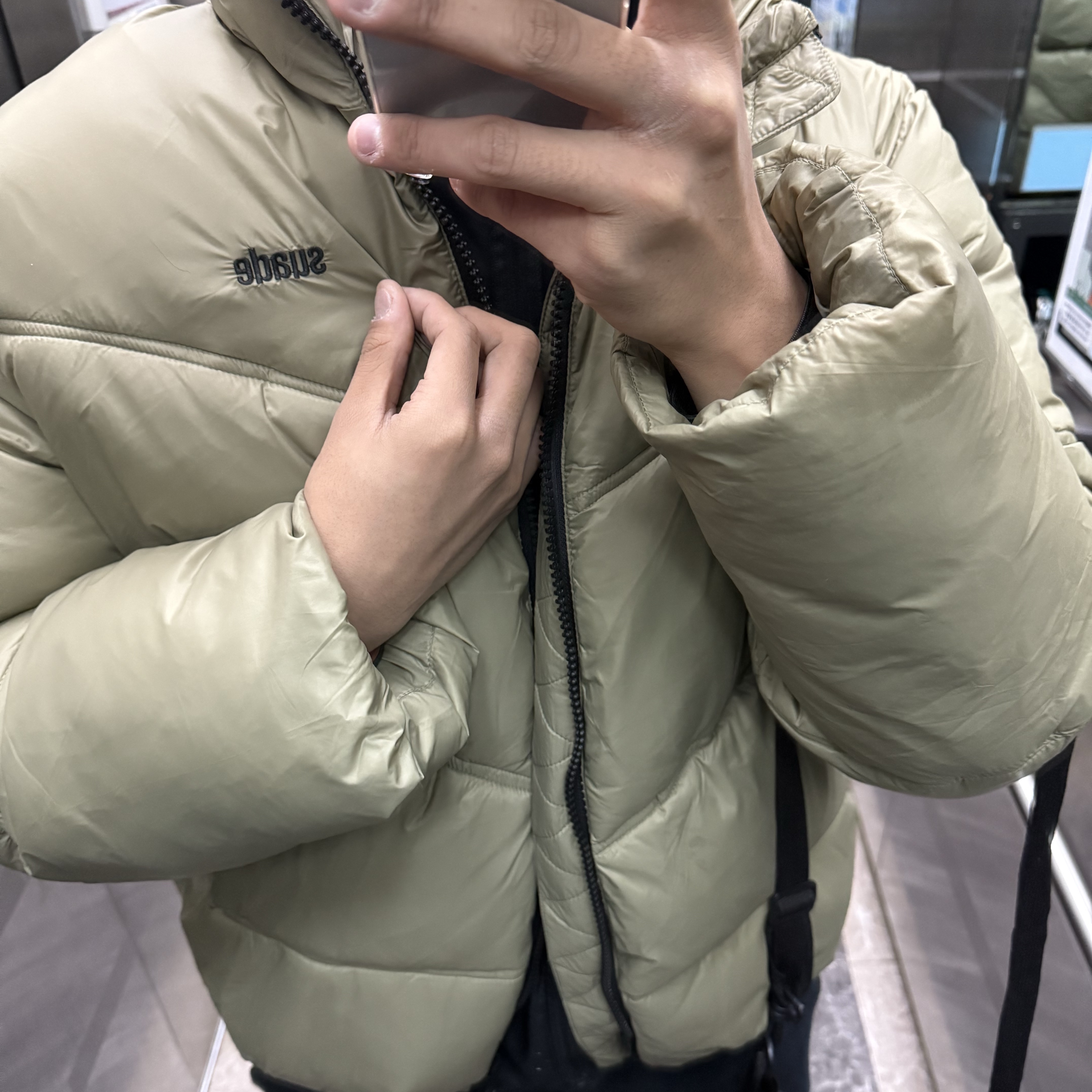 Suade Hooded Puffer Jacket Khaki 착용 스타일