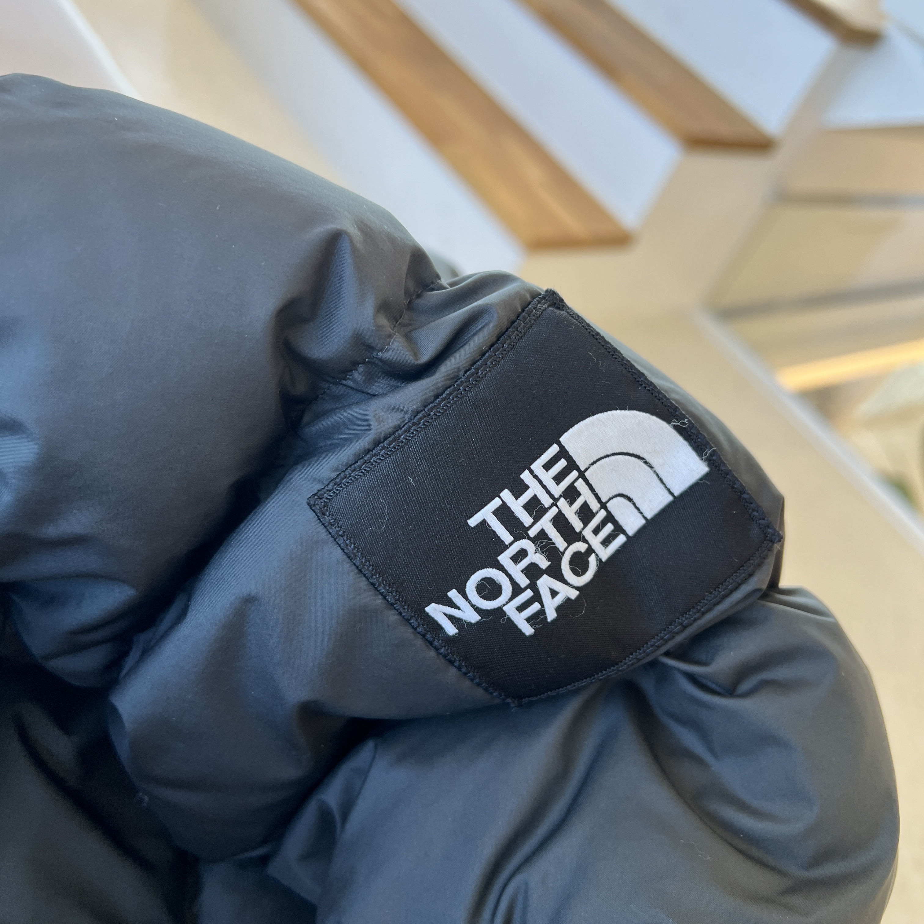 The North Face 1992 Nuptse Jacket Charcoal 착용 스타일