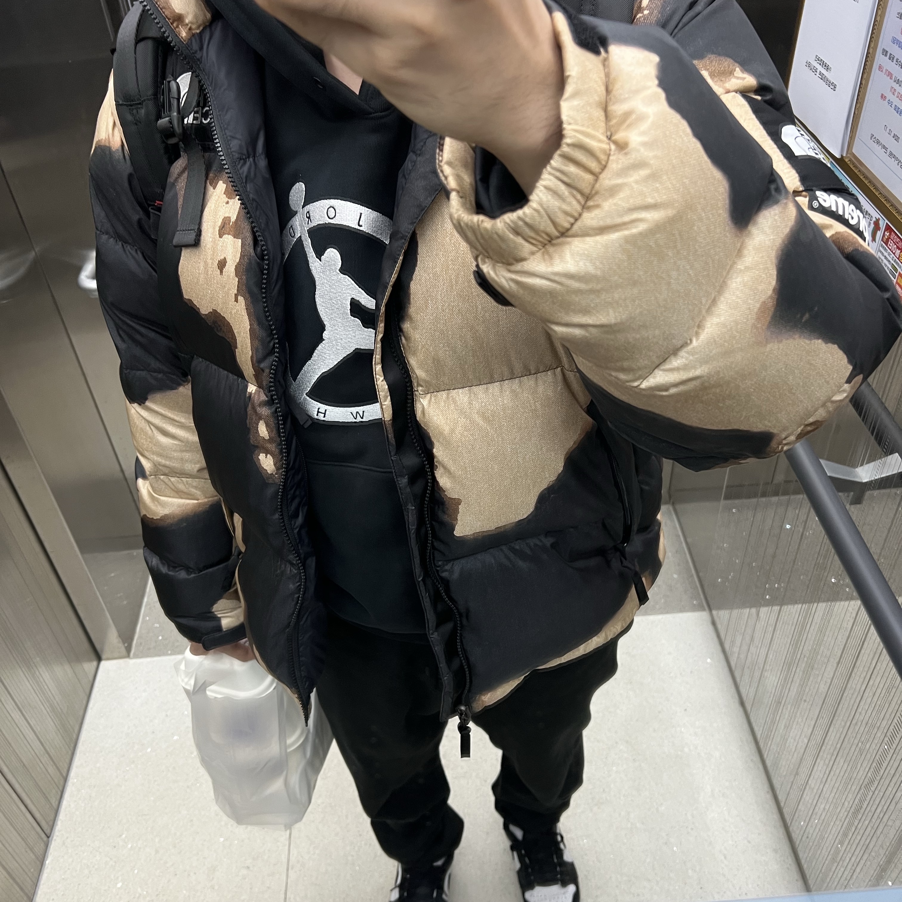 Supreme x The North Face Bleached Denim Print Nuptse Jacket Black - 21FW, Jordan x Off-White Hoodie Black - Asia 착용 스타일