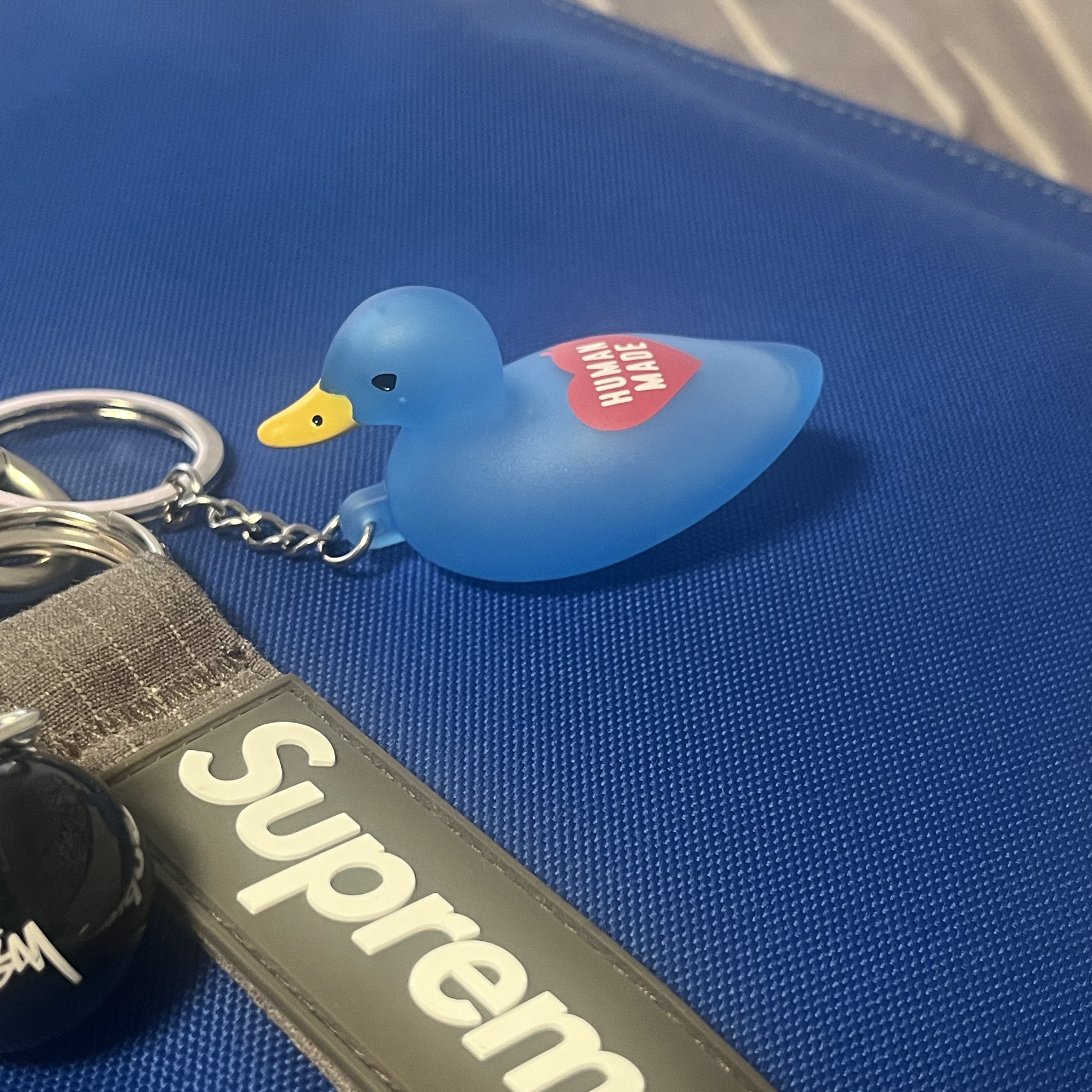 Human Made Duck PVC Key Chain Blue, Stussy 8 Ball Keychain Black 착용 스타일