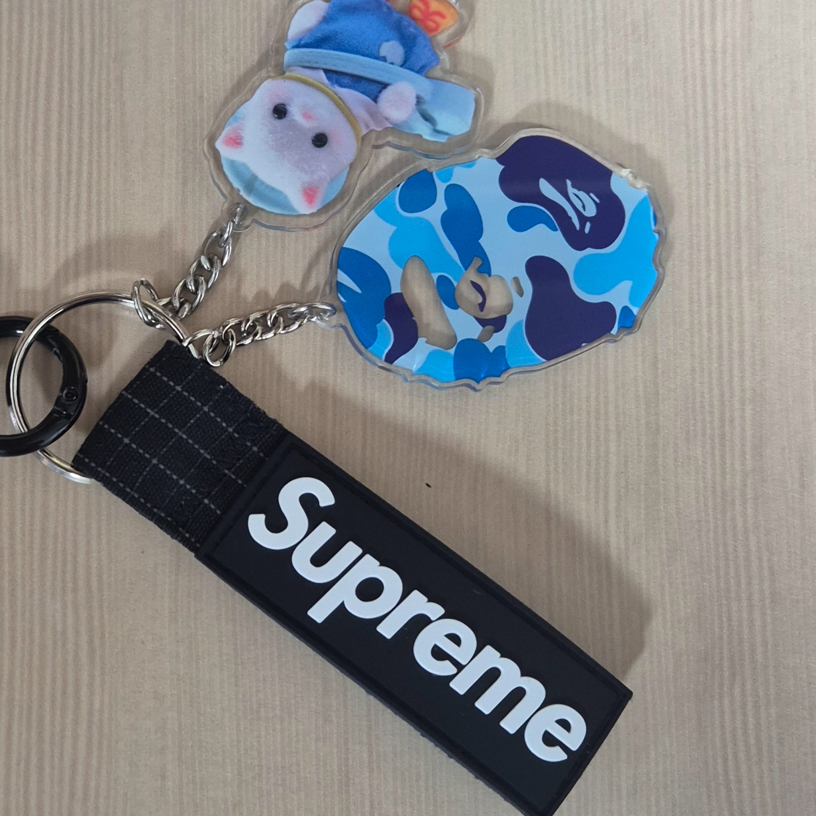 BAPE ABC Camo Ape Head Acrylic Keychain Blue, Supreme Ripstop Keychain Black - 24SS 착용 스타일