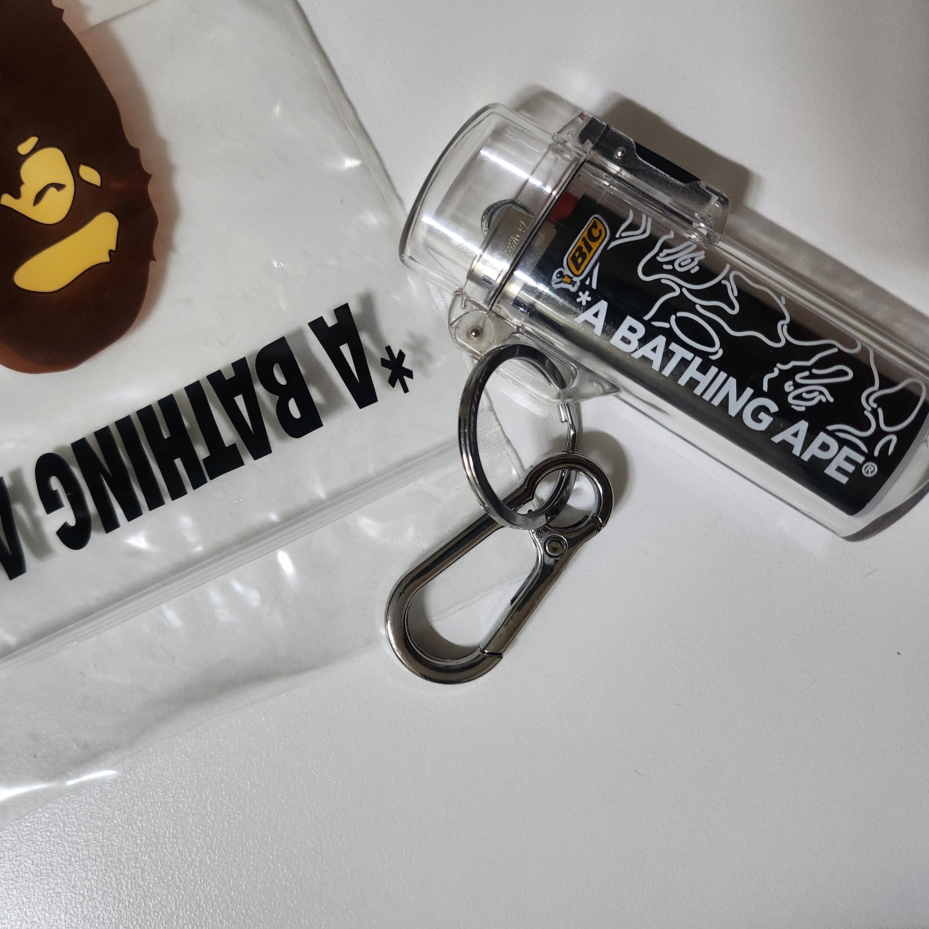 BAPE Neon Camo Lighter Case Keychain Silver 착용 스타일