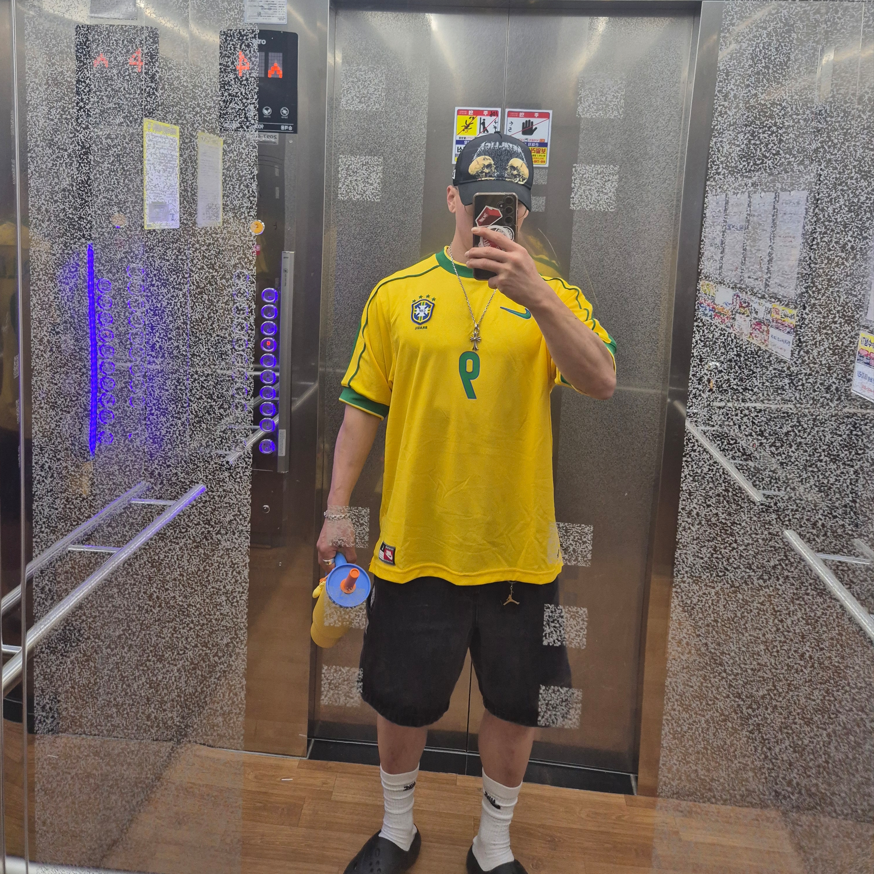 Nike Brazil 1998 Reissue Soccer Replica Jersey Varsity Maize Ronaldo (Marking Ver.), New Era x Metallica Double Skull A-Frame Trucker Ball Cap Black 착용 스타일