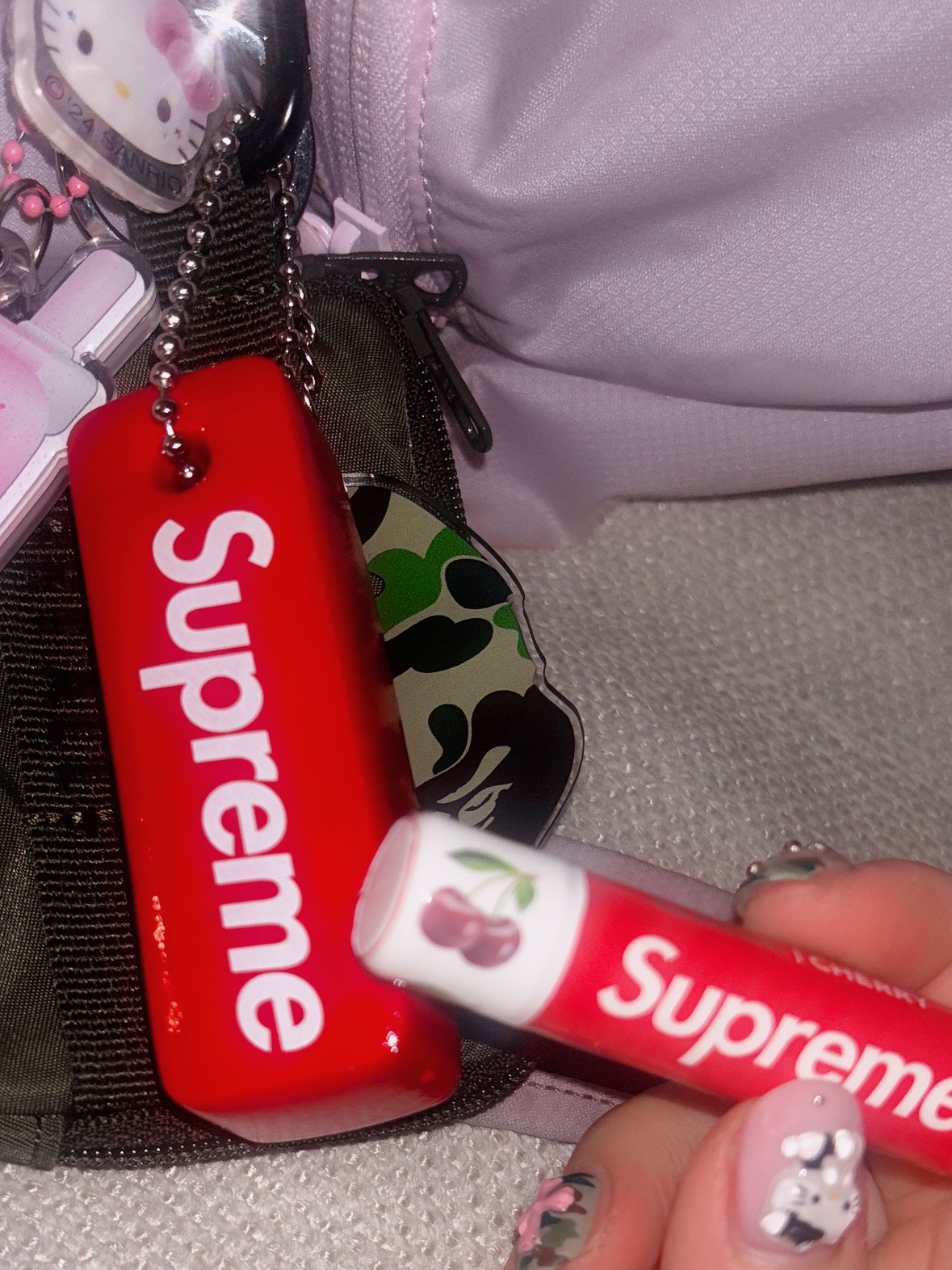 Supreme Chapstick Red (3 Pack), Supreme Floating Keychain Red - 23FW 착용 스타일