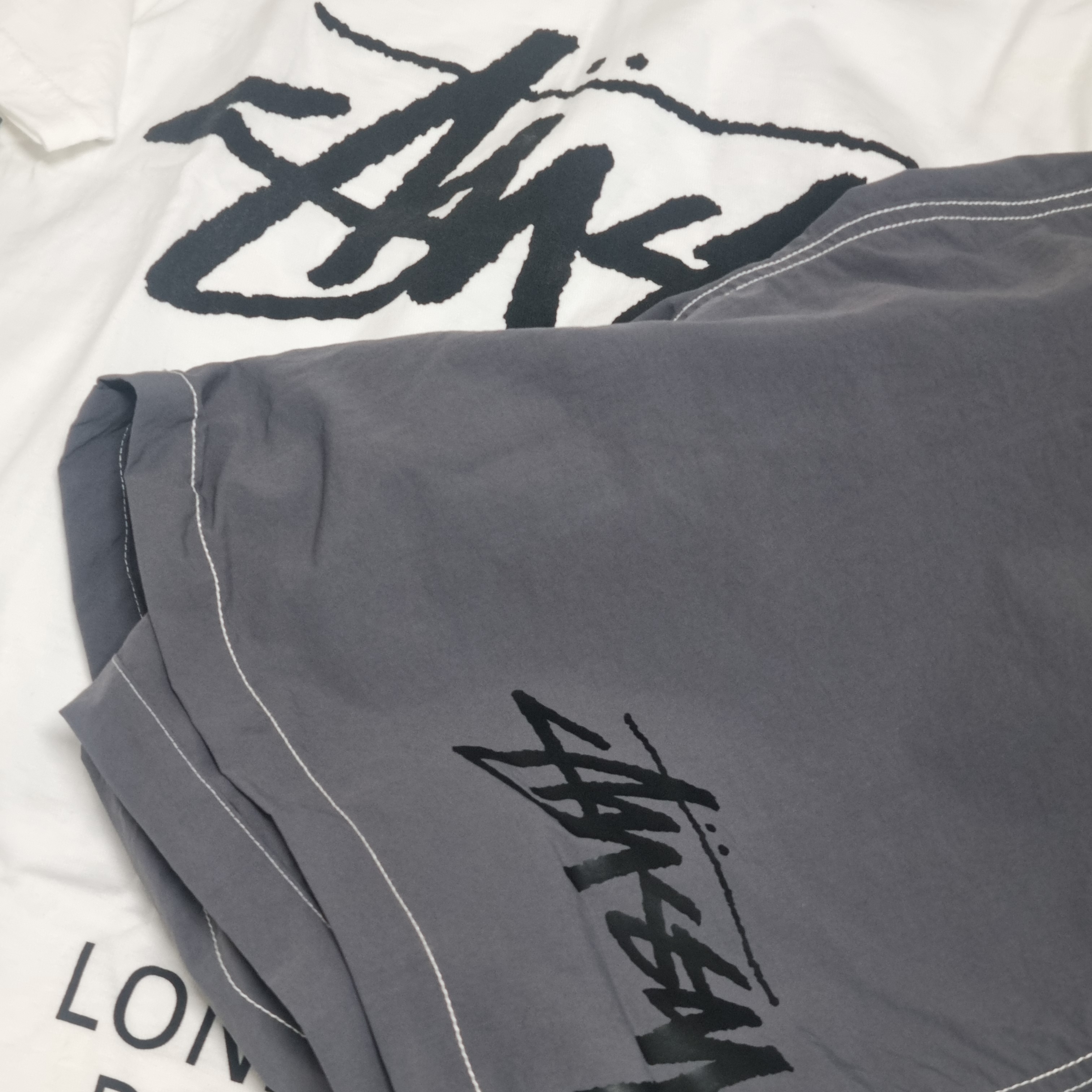 Stussy x Our Legacy Work Shop Water Shorts Charcoal, Stussy World Tour T-Shirt White 2024,2025 착용 스타일