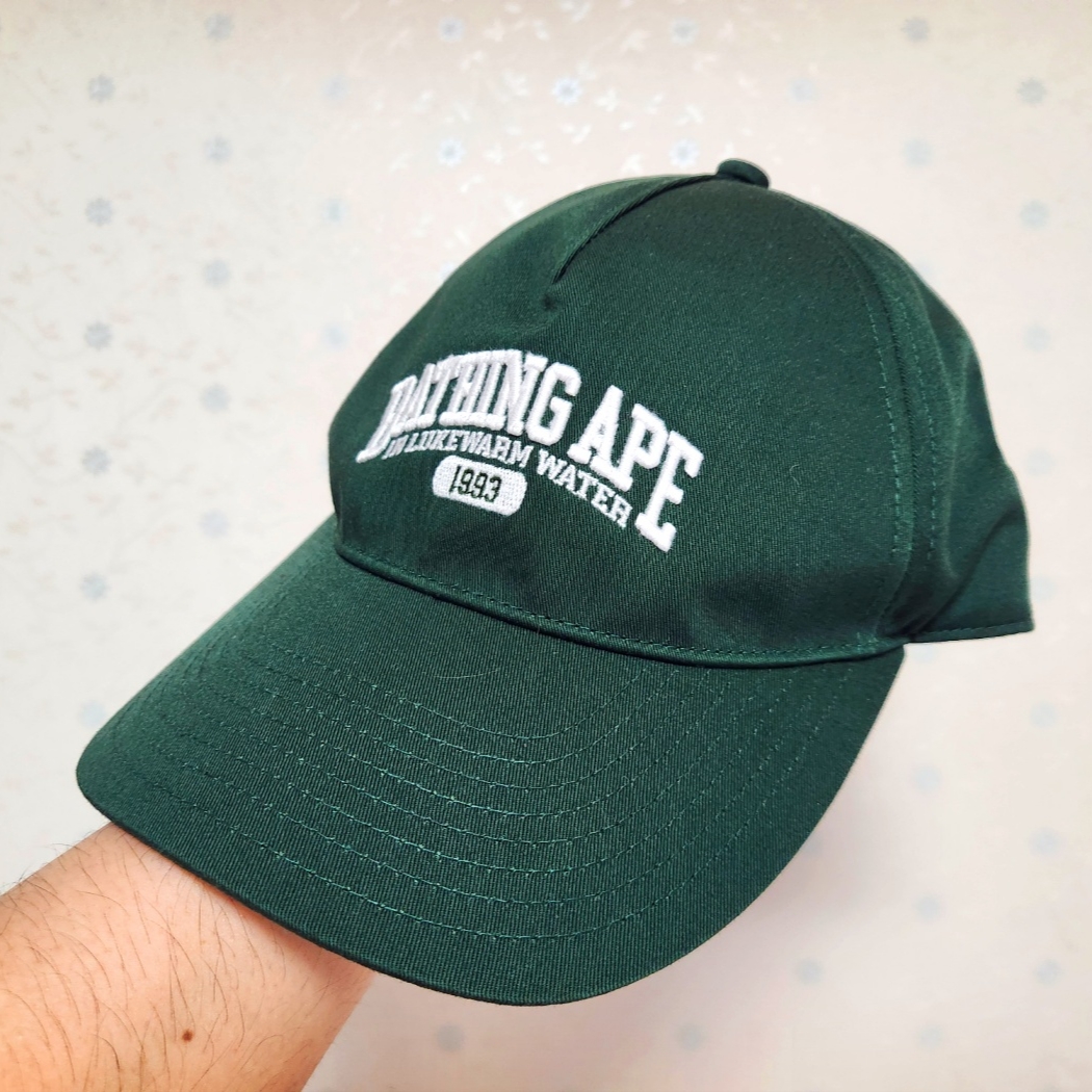BAPE Logo Trucker Cap Olive Drab 착용 스타일 - 1