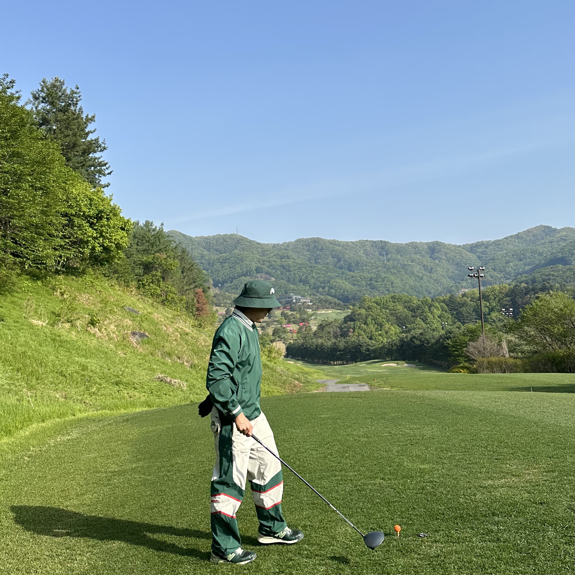 Malbon Golf Tiger Buckets Piste Green 착용 스타일