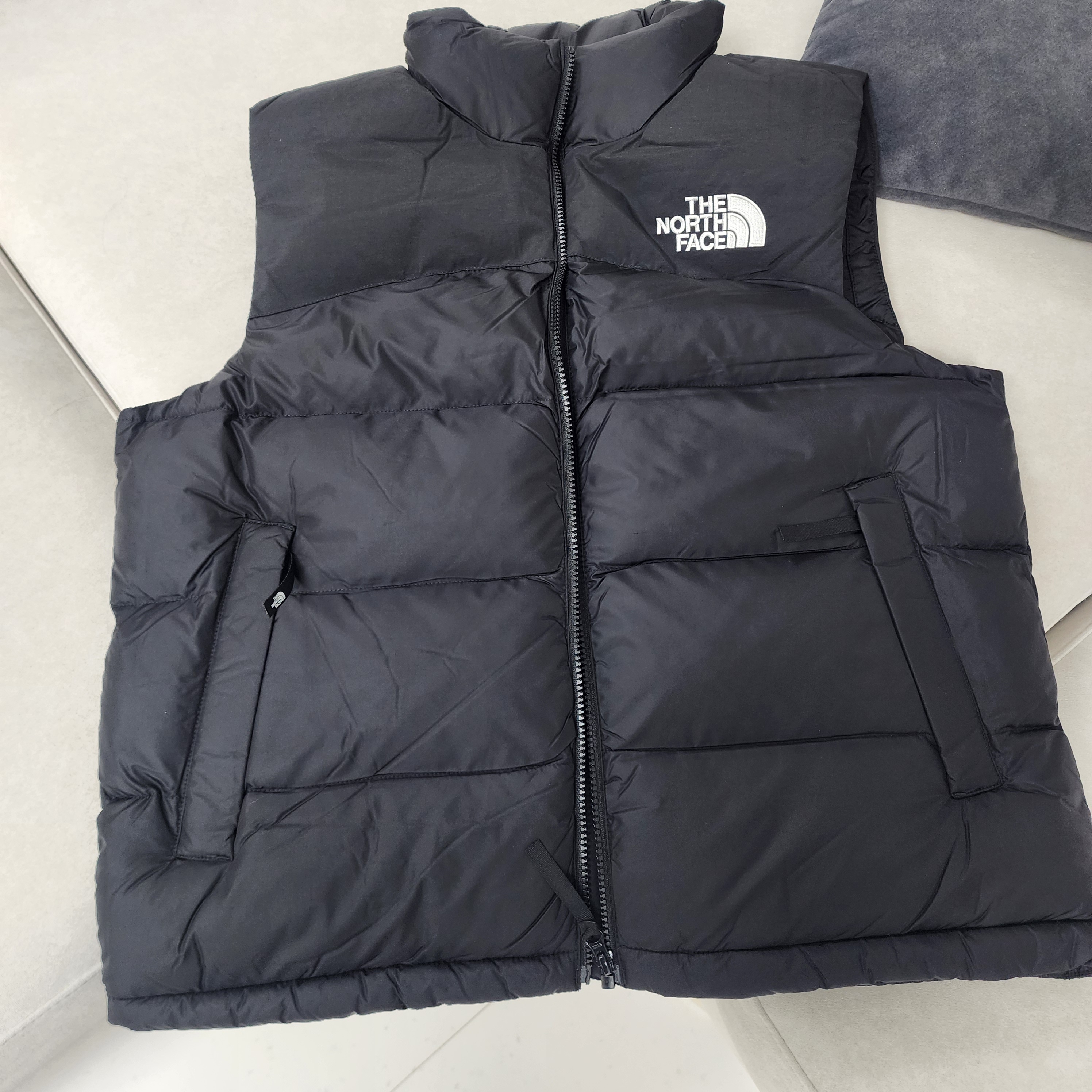 노스페이스 뉴 퍼피 EX 온 볼 베스트 블랙 - 24FW | The North Face
