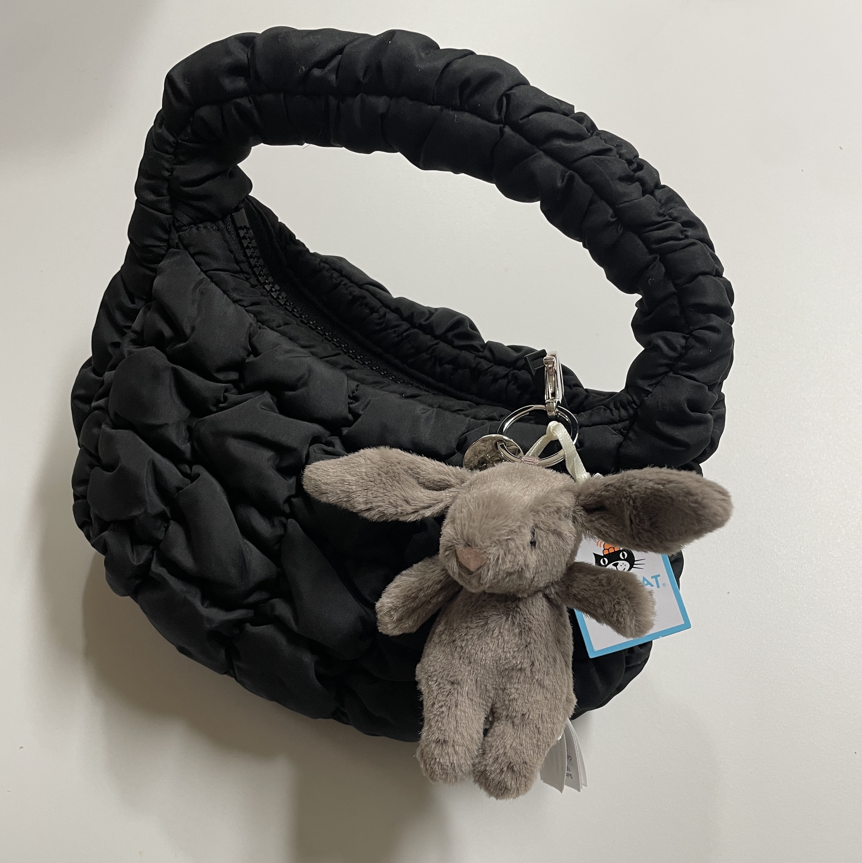 COS Quilted Micro Bag Black, Jellycat Bashful Bunny Truffle Bag Charm Brown 착용 스타일