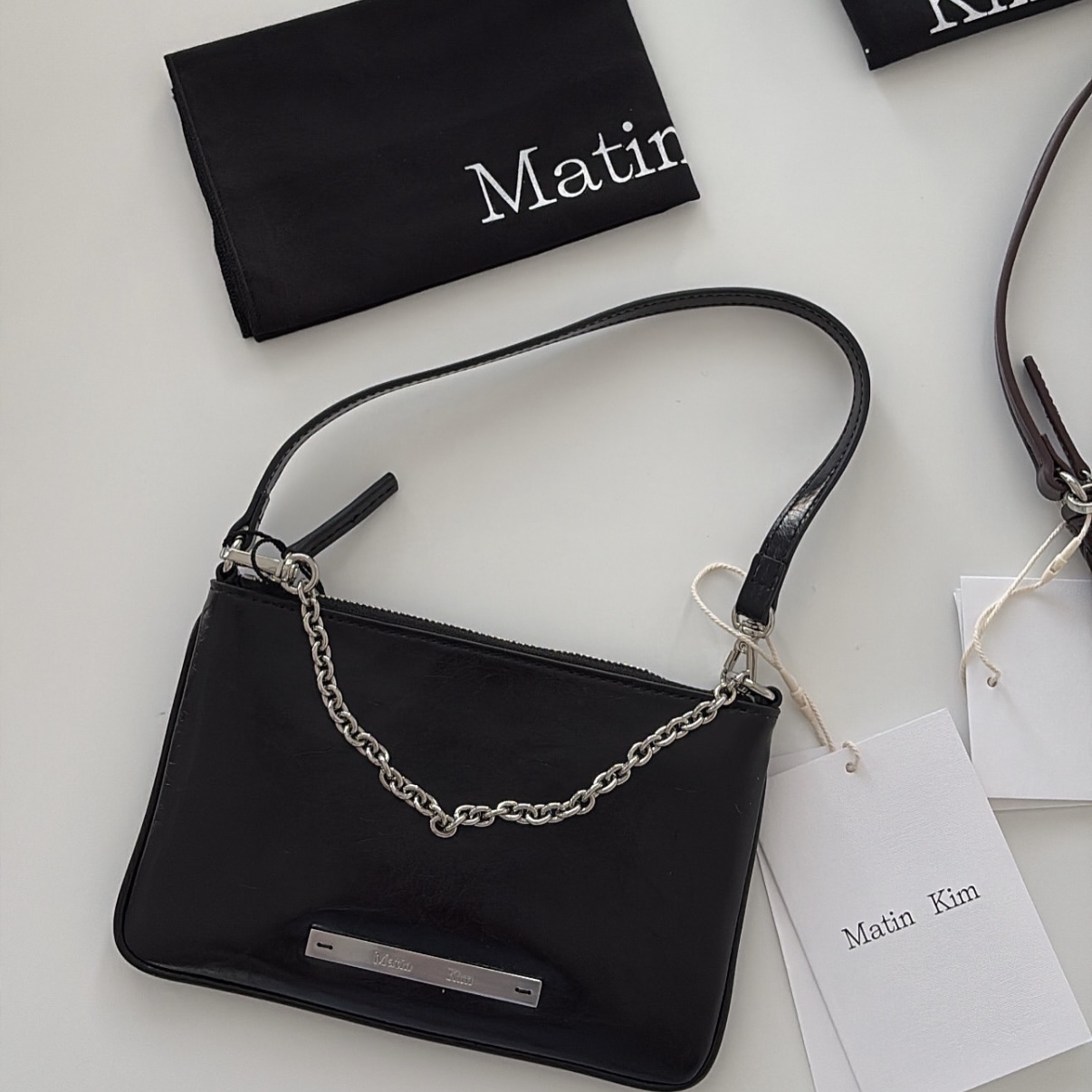 Matin Kim Glossy Leather Micro Bag Black 착용 스타일