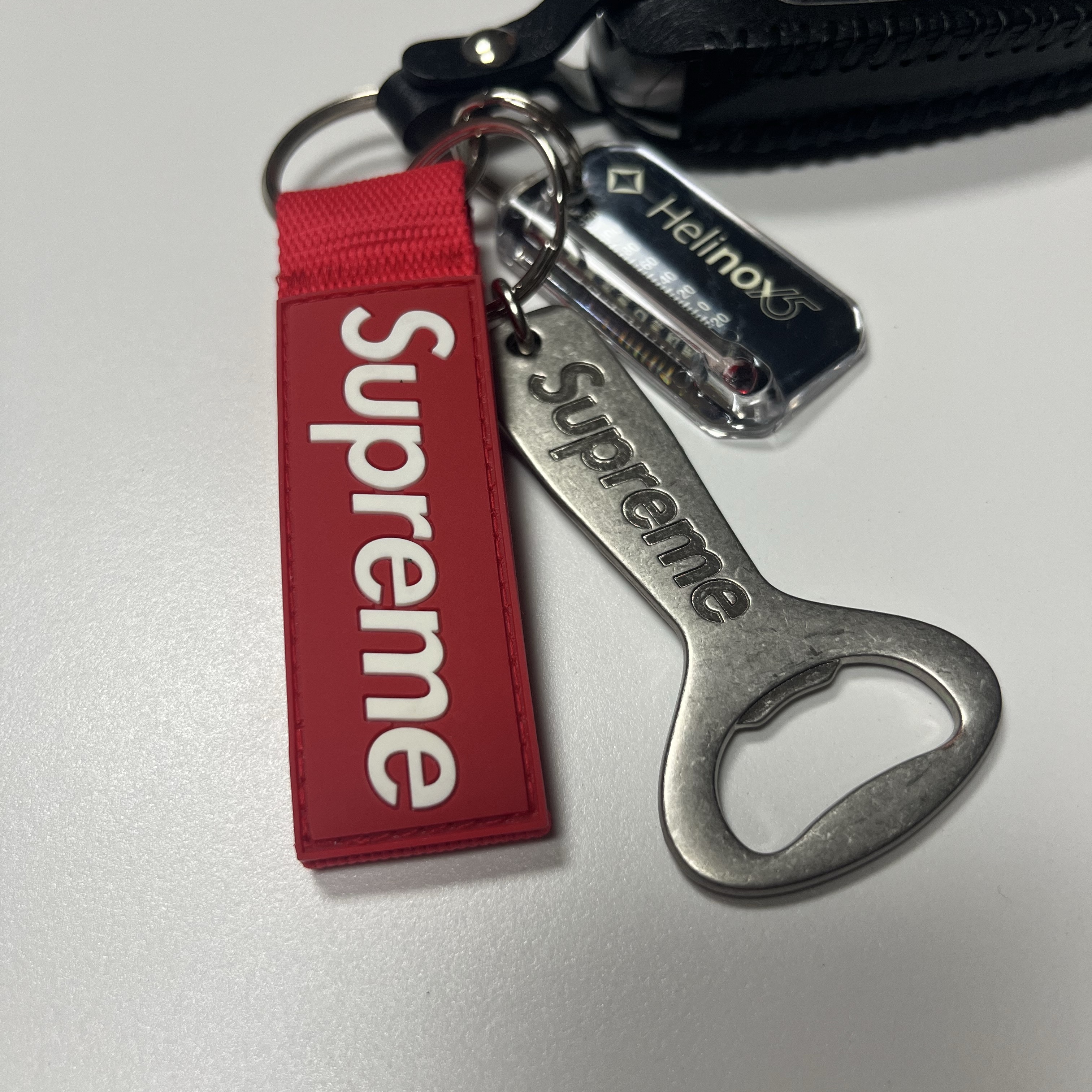 Supreme Bottle Opener Keychain Silver - 24FW, Supreme Webbing Keychain Red - 23SS 착용 스타일